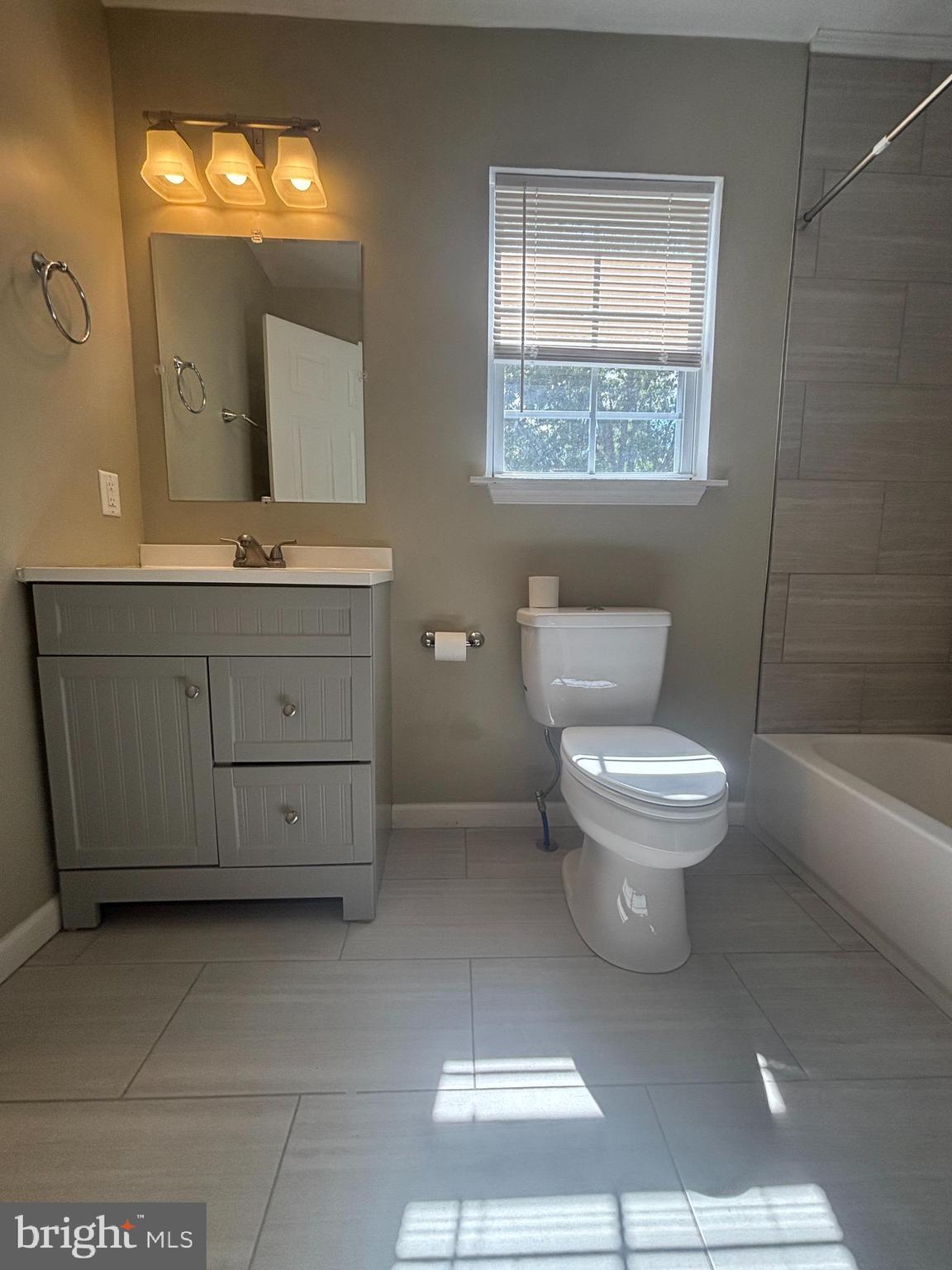 3 Balsley Court Sicklerville, NJ 08081 - Photo 15 of 24 a bathroom with a toilet sink and mirror