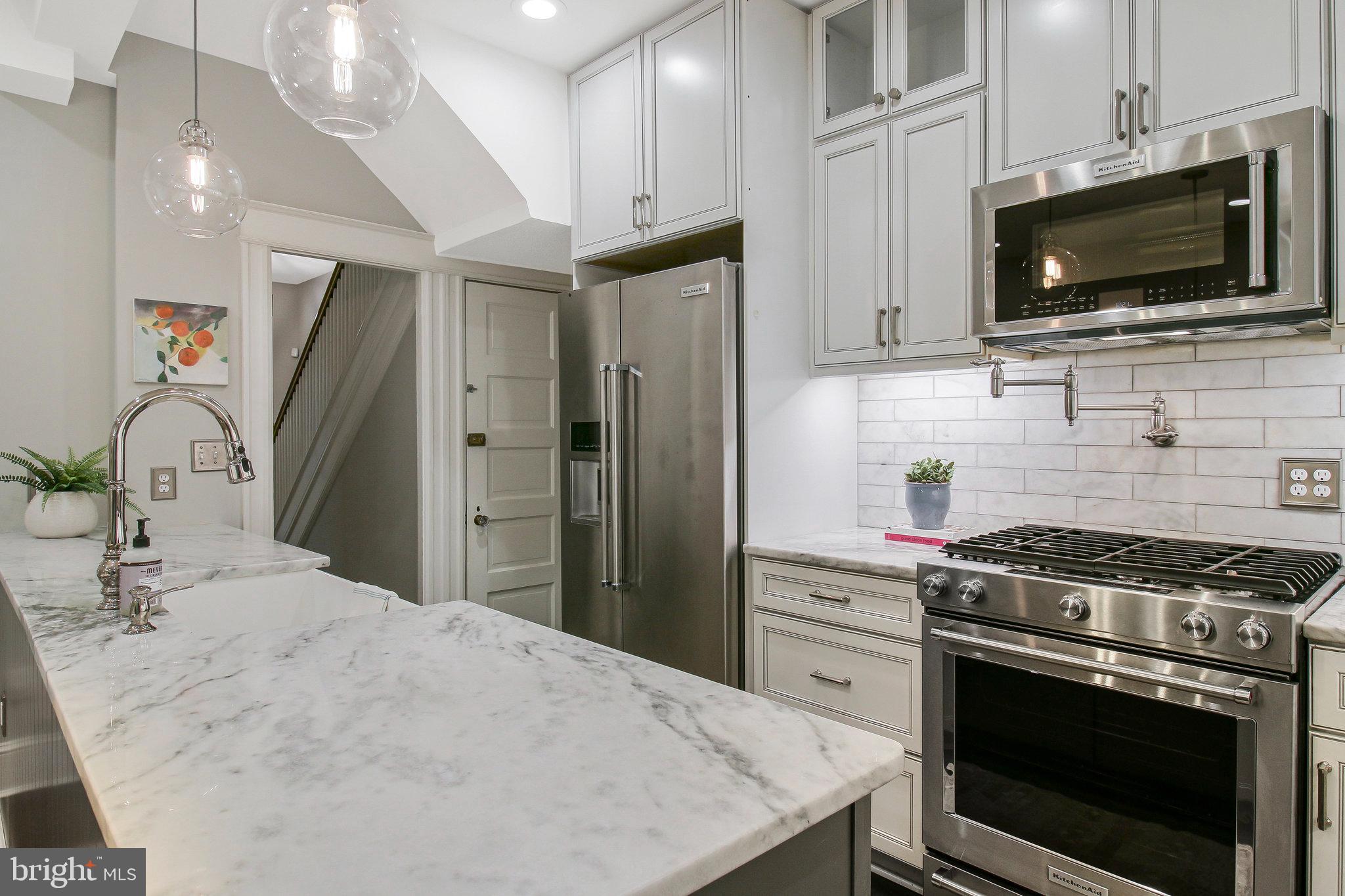 239 11th Street Southeast Washington, DC 20003 - Photo 15 of 53 a kitchen with a stove and a microwave