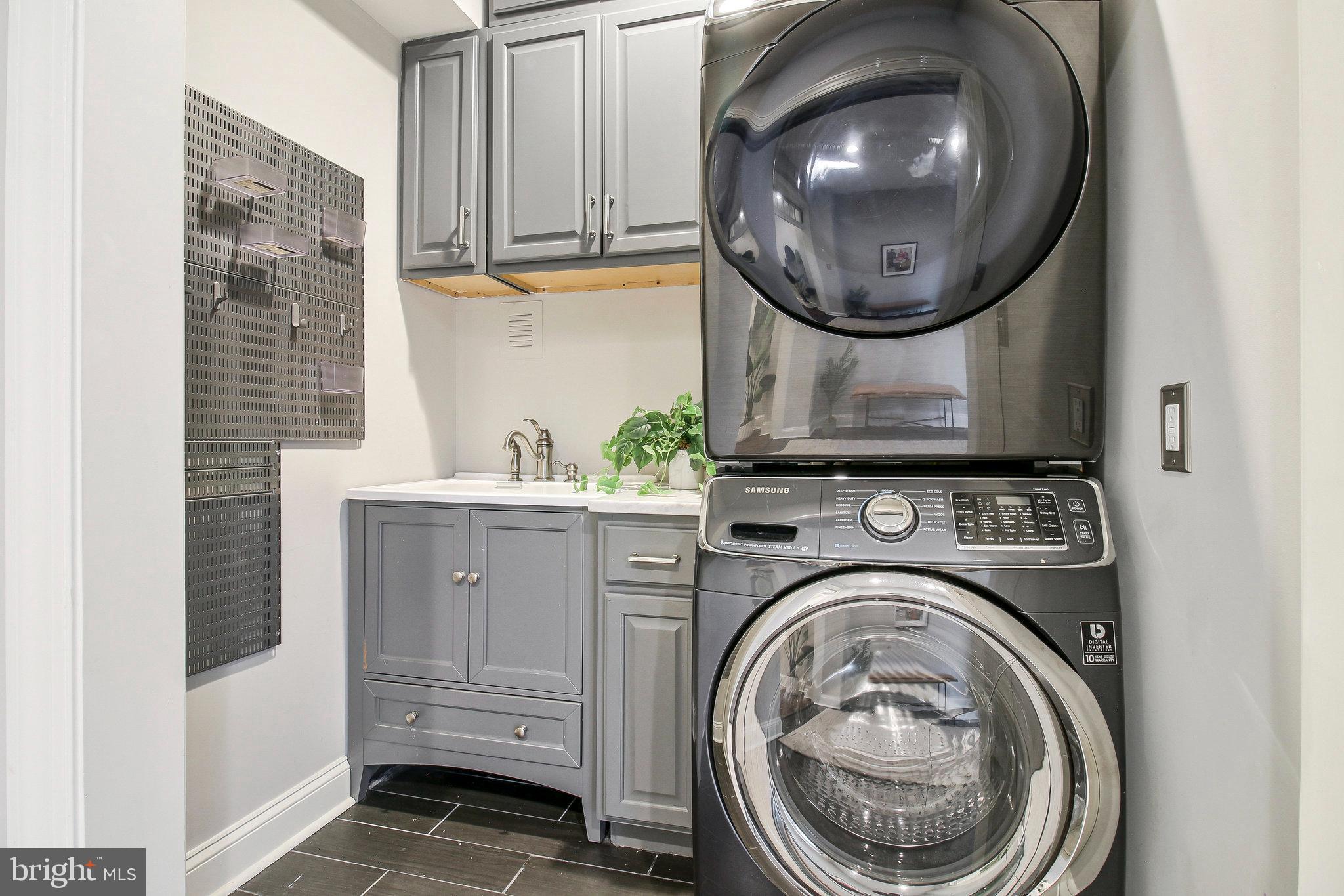 239 11th Street Southeast Washington, DC 20003 - Photo 17 of 53 a bathroom with a sink and a mirror