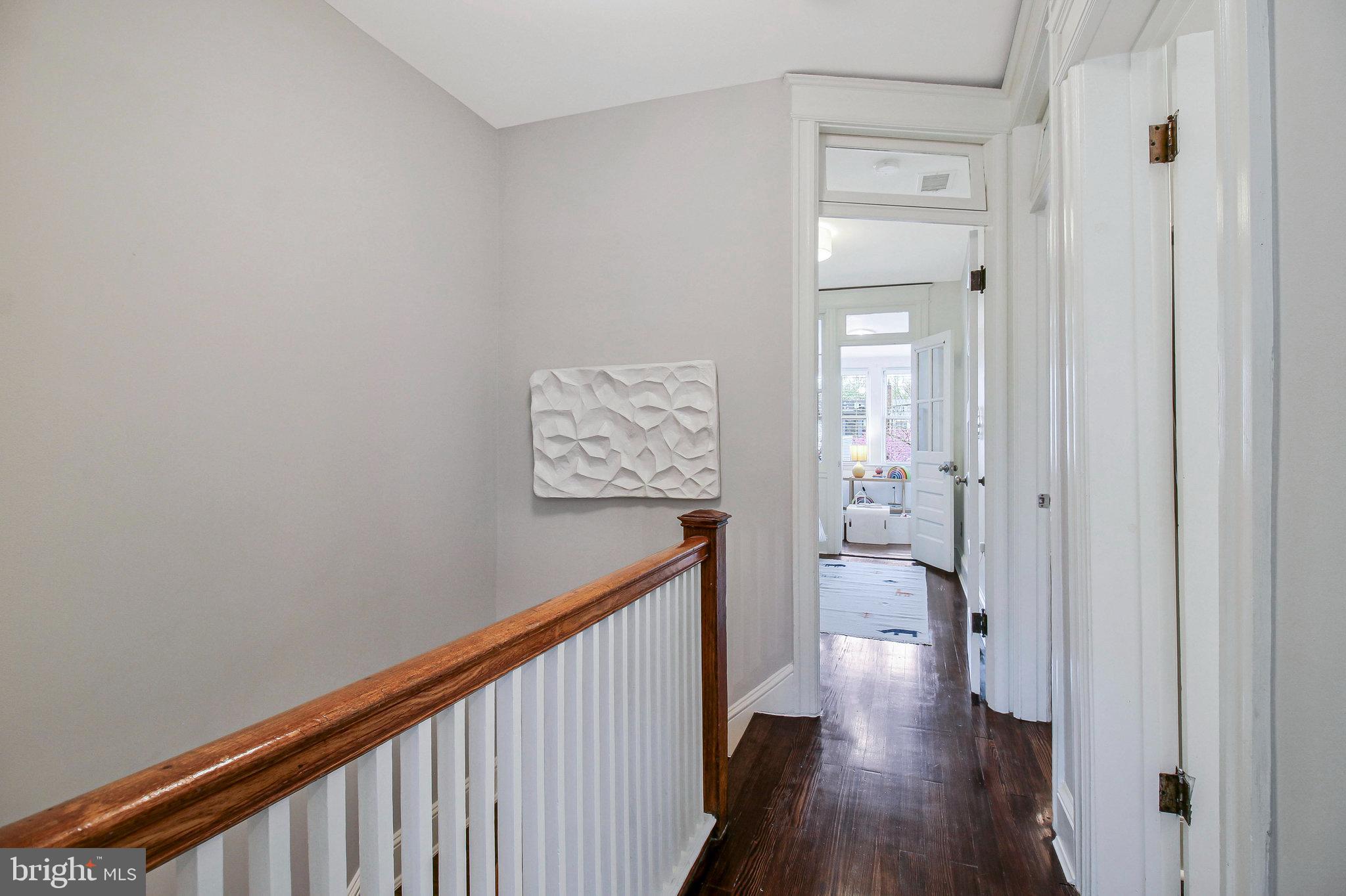 239 11th Street Southeast Washington, DC 20003 - Photo 27 of 53 a view of a hallway with wooden floor