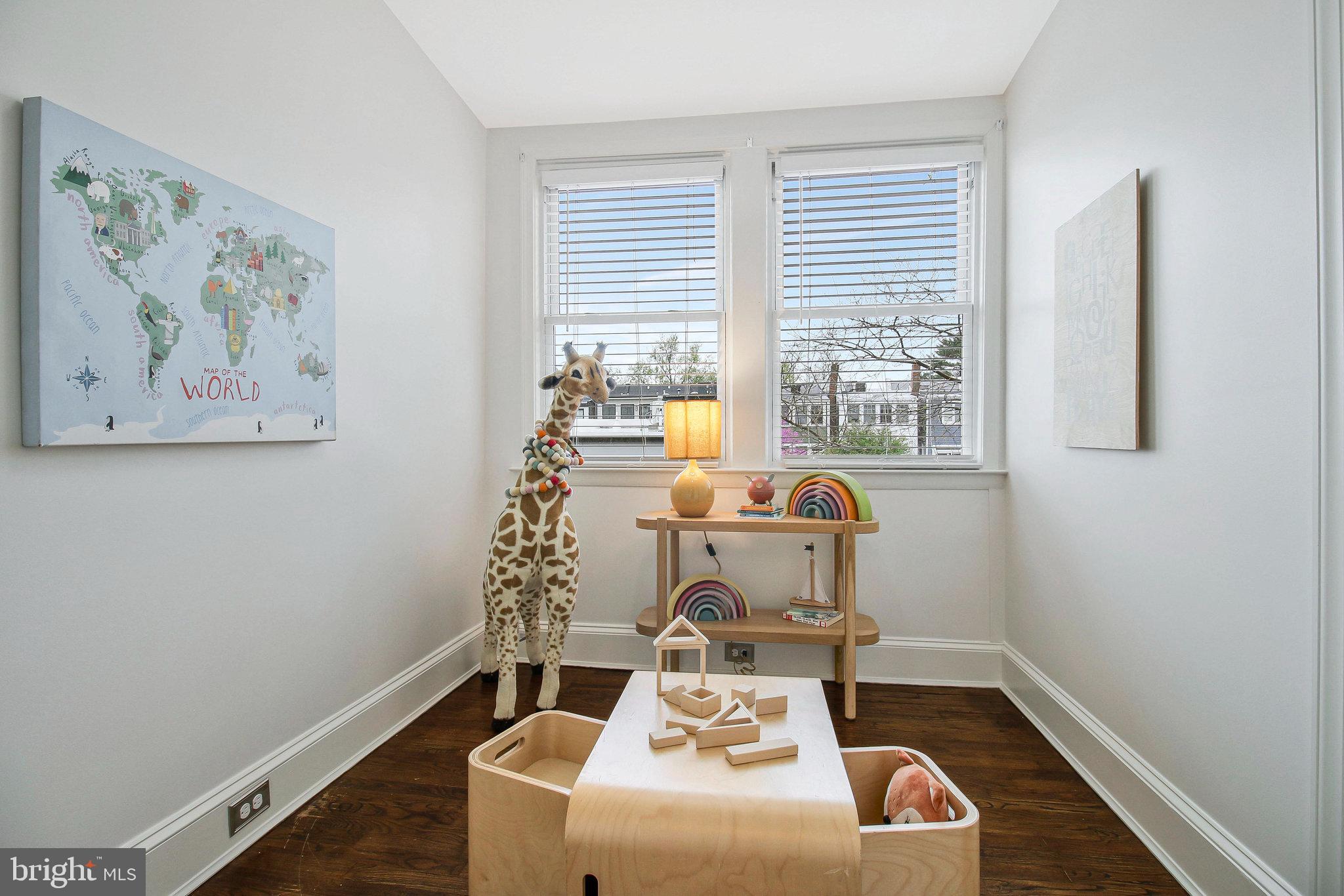 239 11th Street Southeast Washington, DC 20003 - Photo 30 of 53 a room with furniture and window