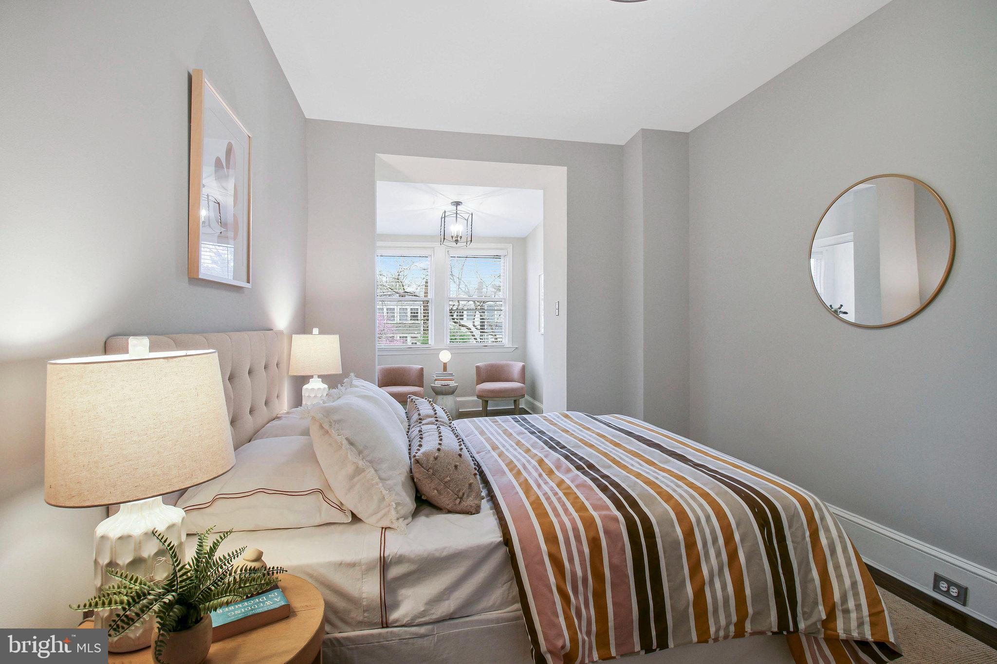 239 11th Street Southeast Washington, DC 20003 - Photo 32 of 53 a bedroom with a bed and a window