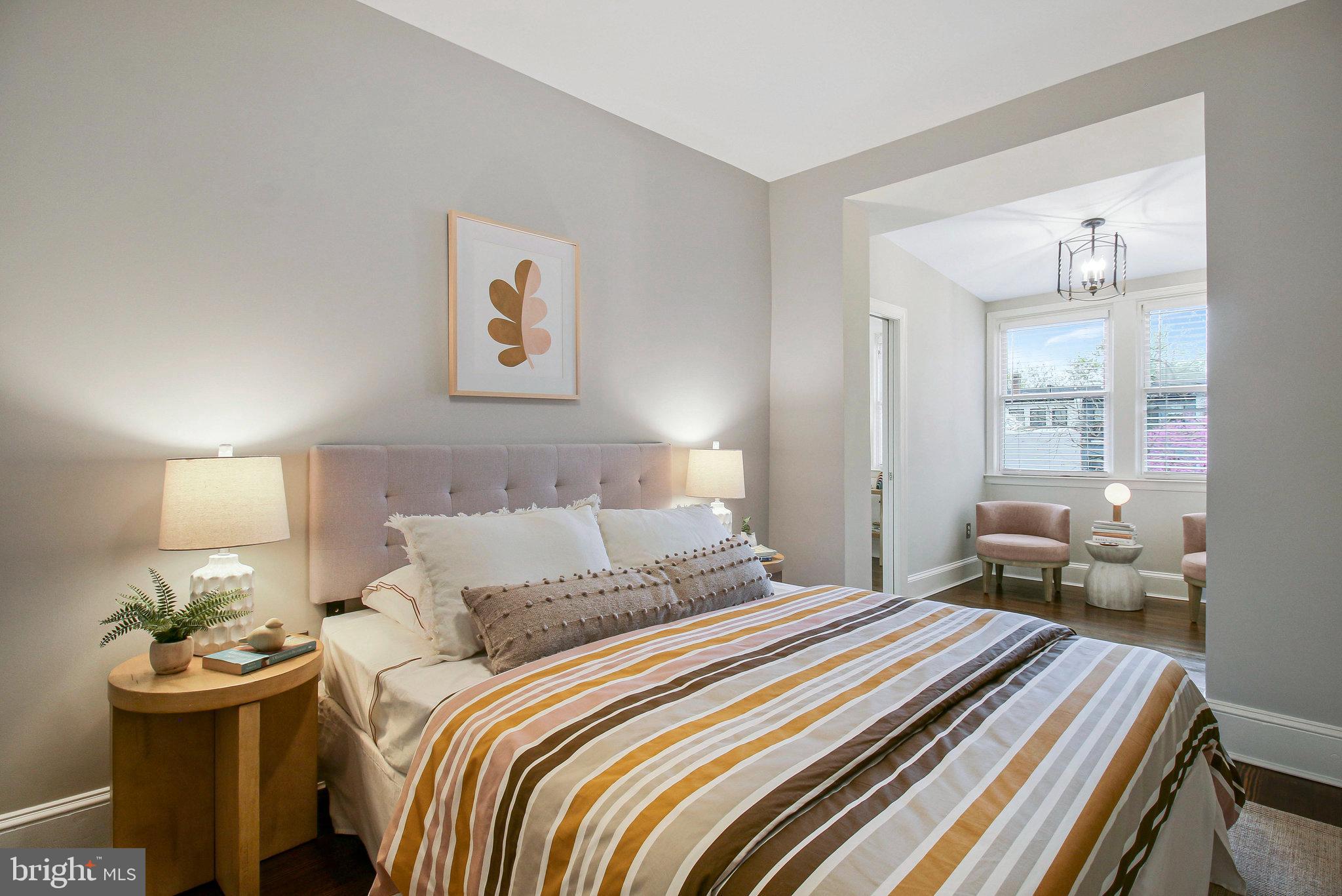 239 11th Street Southeast Washington, DC 20003 - Photo 34 of 53 a bedroom with a bed and wooden floor
