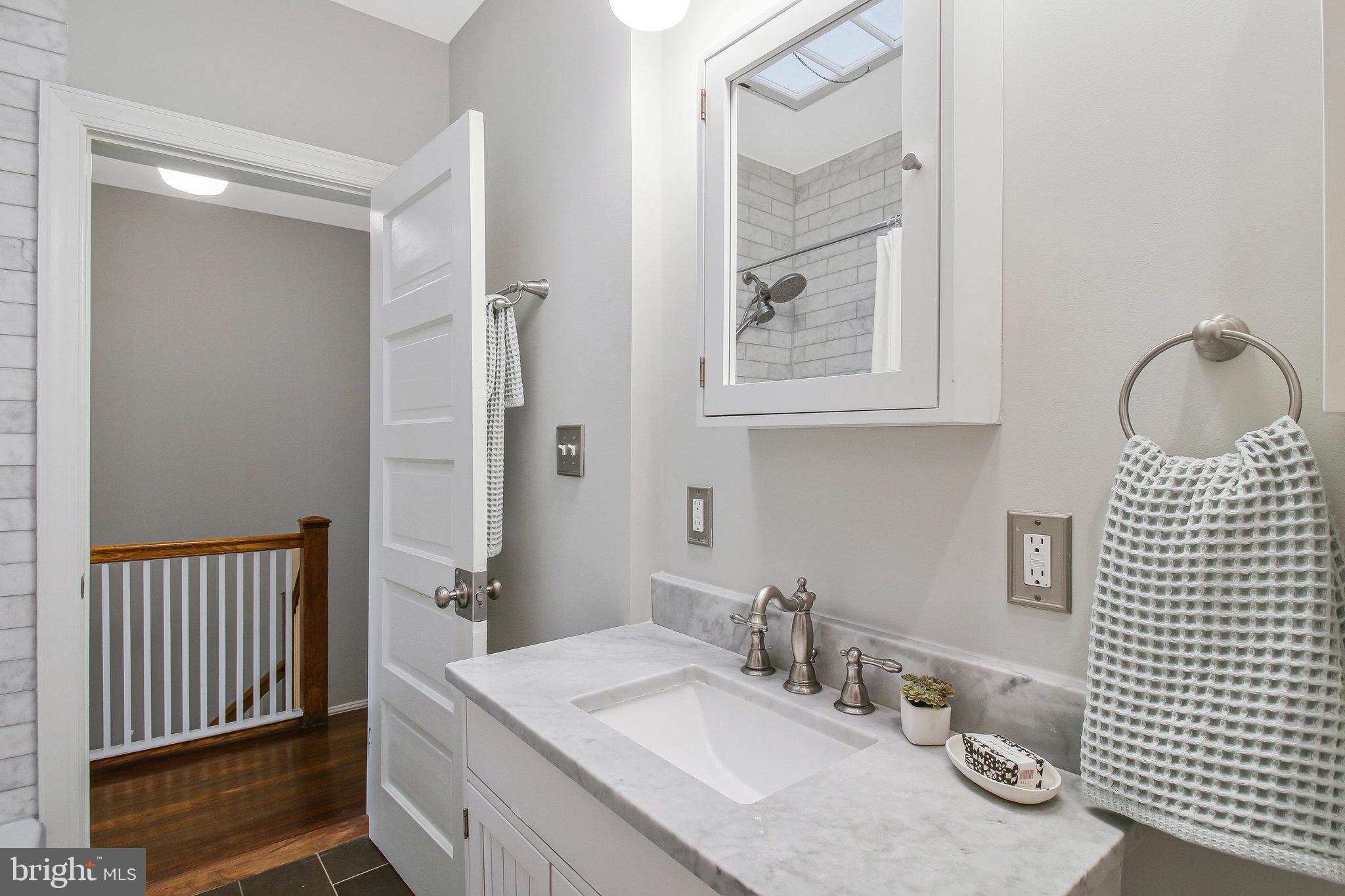 239 11th Street Southeast Washington, DC 20003 - Photo 36 of 53 a bathroom with a sink toilet and shower