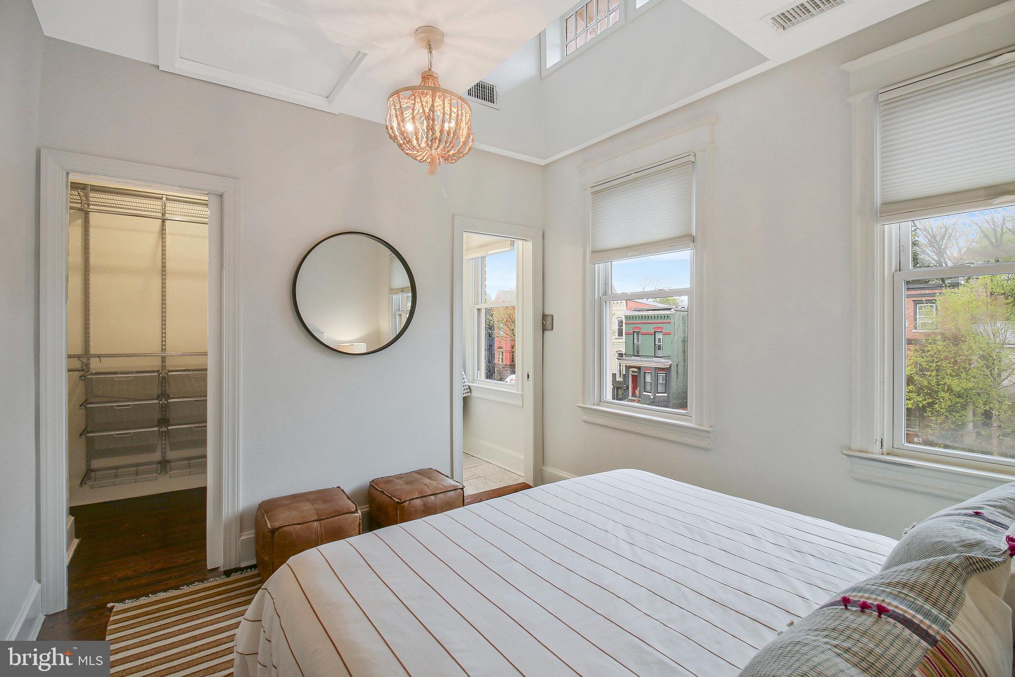 239 11th Street Southeast Washington, DC 20003 - Photo 40 of 53 a bedroom with a bed and a window