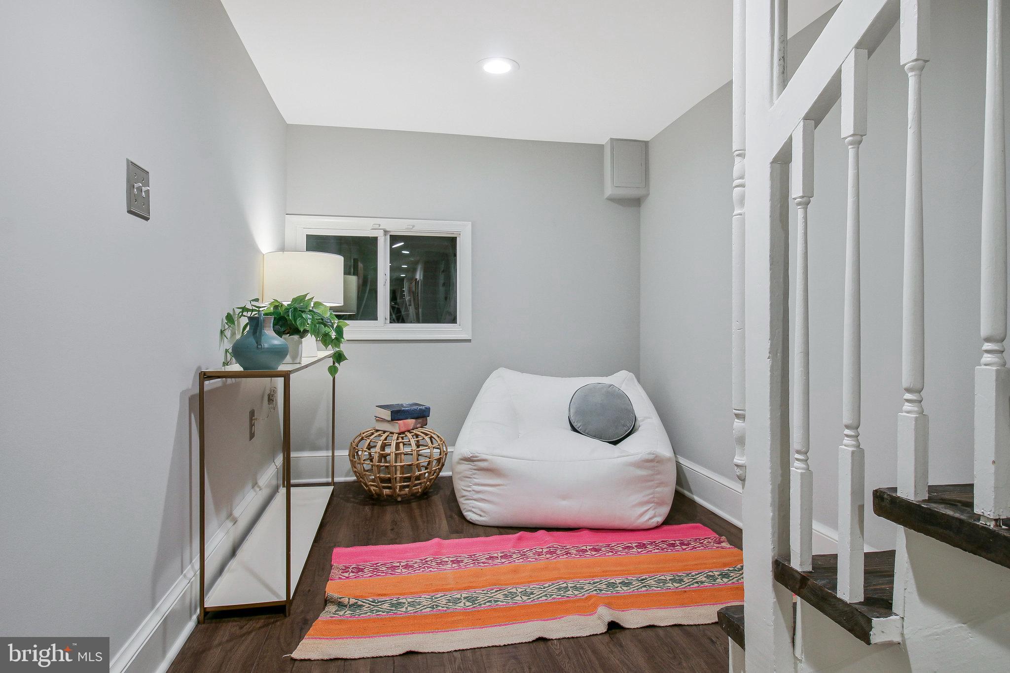 239 11th Street Southeast Washington, DC 20003 - Photo 44 of 53 a bedroom with a bed and a window