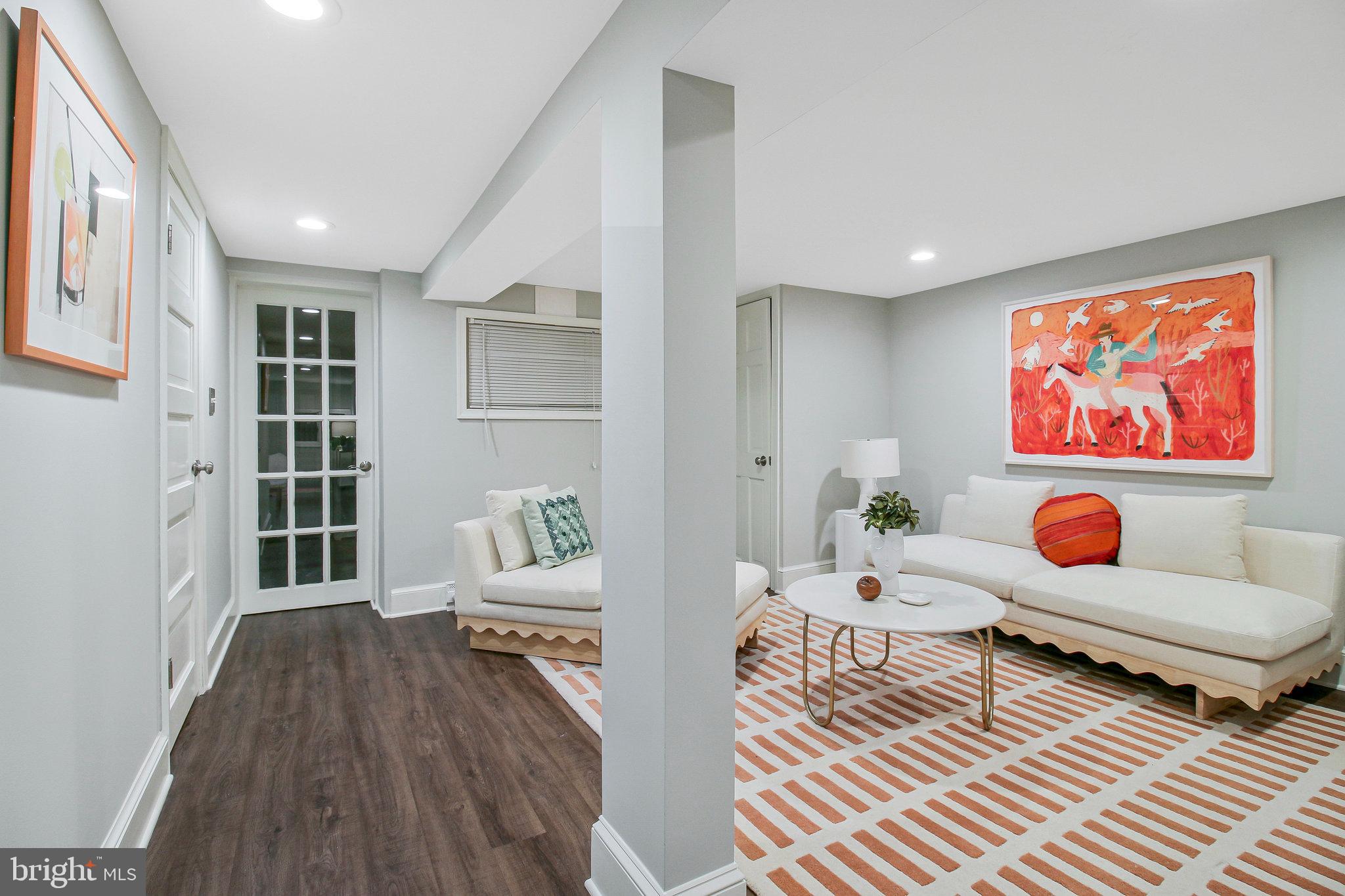 239 11th Street Southeast Washington, DC 20003 - Photo 48 of 53 a living room with furniture and wooden floor