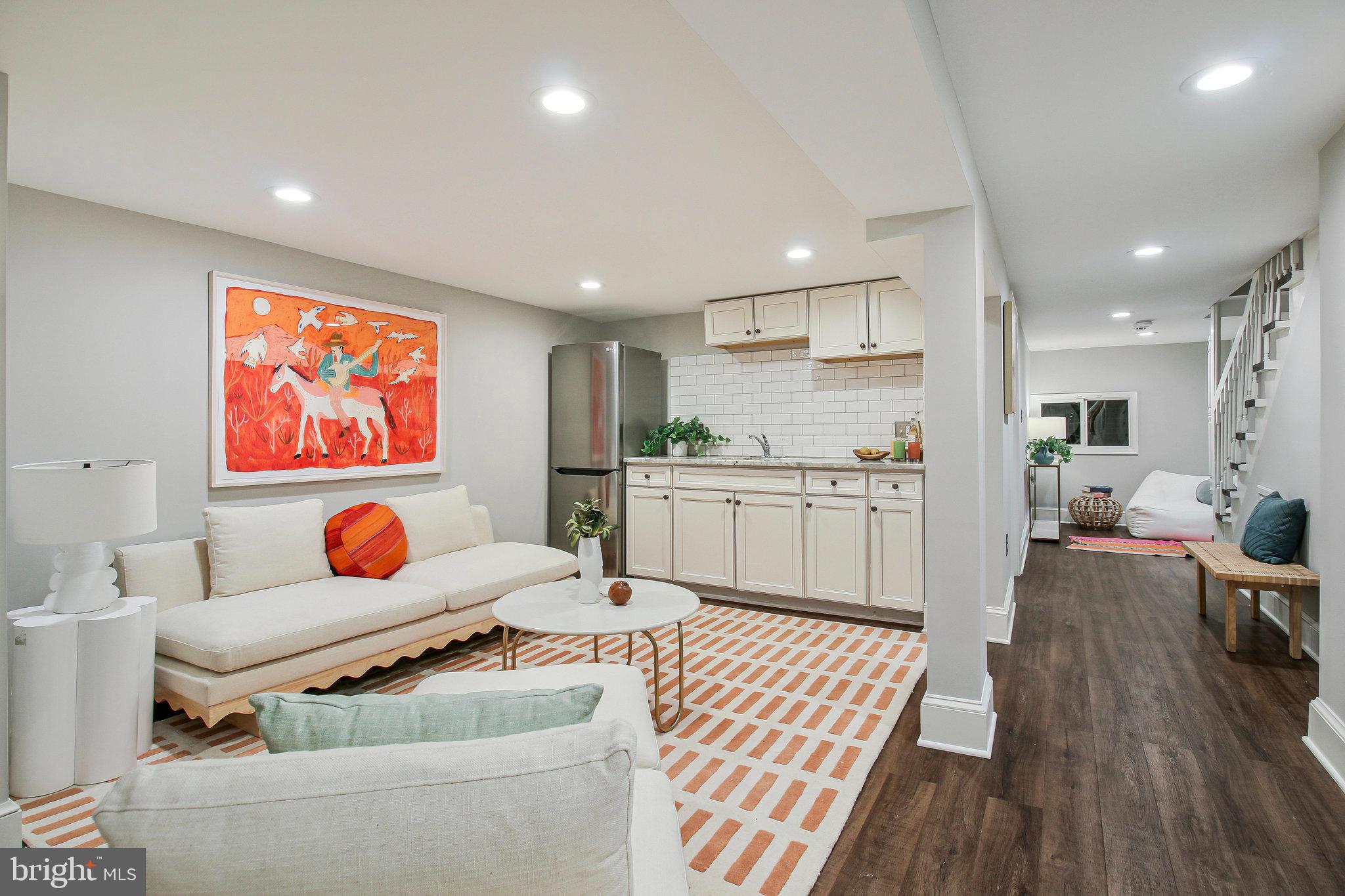 239 11th Street Southeast Washington, DC 20003 - Photo 49 of 53 a living room with furniture and kitchen view
