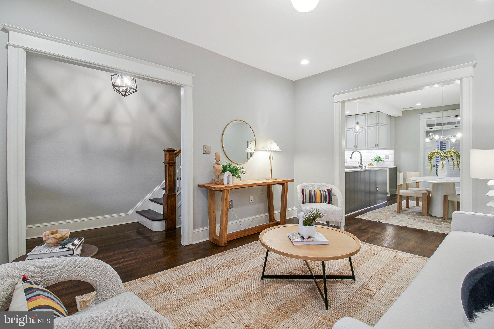 239 11th Street Southeast Washington, DC 20003 - Photo 8 of 53 a living room with furniture and a potted plant