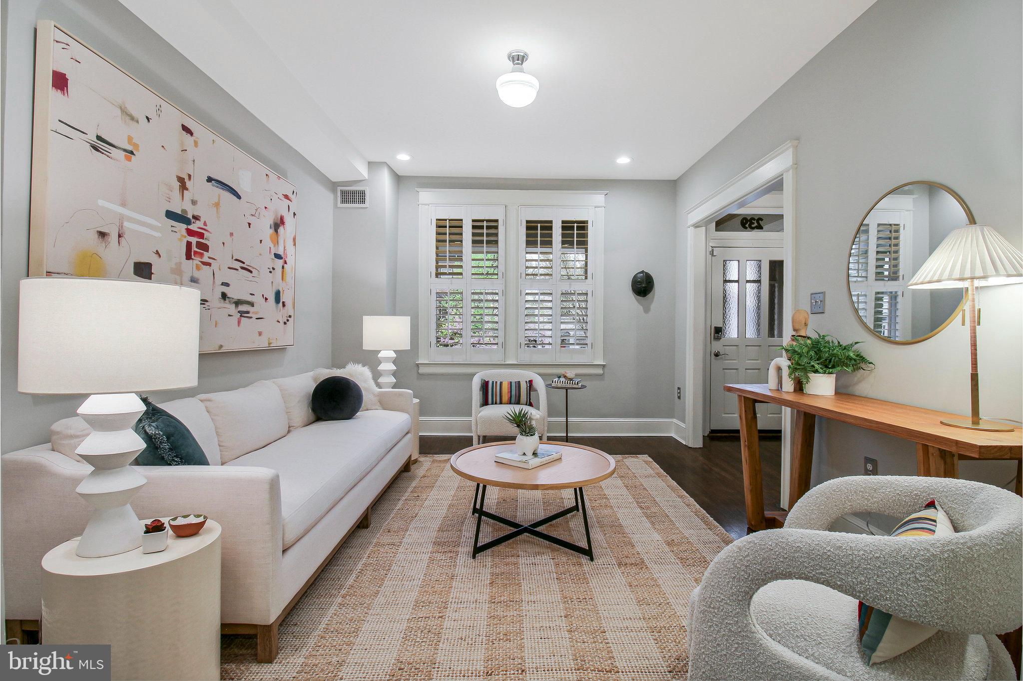 239 11th Street Southeast Washington, DC 20003 - Photo 9 of 53 a living room with furniture and a large window