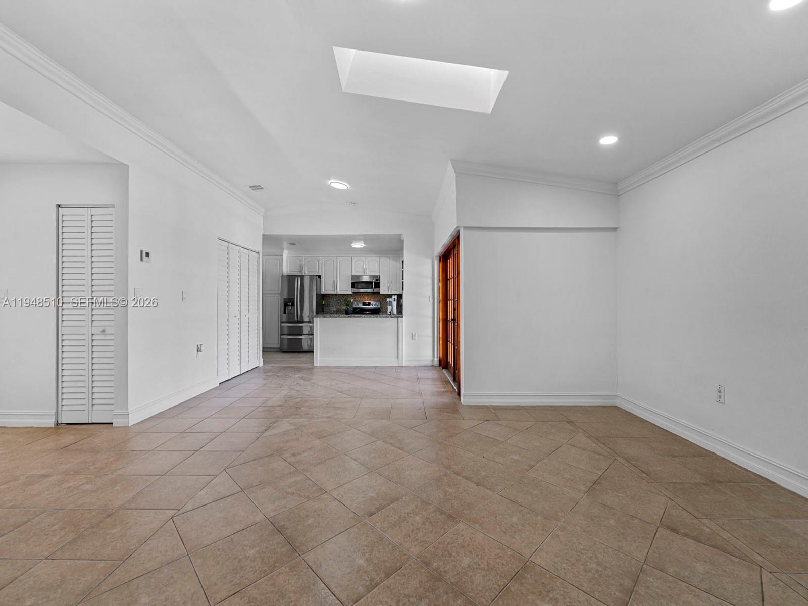 25921 Southwest 130th Avenue Homestead, FL 33032 - Photo 11 of 38 a view of a livingroom with furniture and an empty room