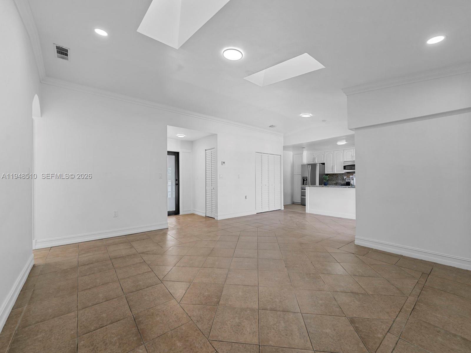25921 Southwest 130th Avenue Homestead, FL 33032 - Photo 12 of 38 a view of a livingroom with a kitchen