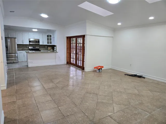 a view of kitchen with stainless steel appliances cabinets and a kitchen view