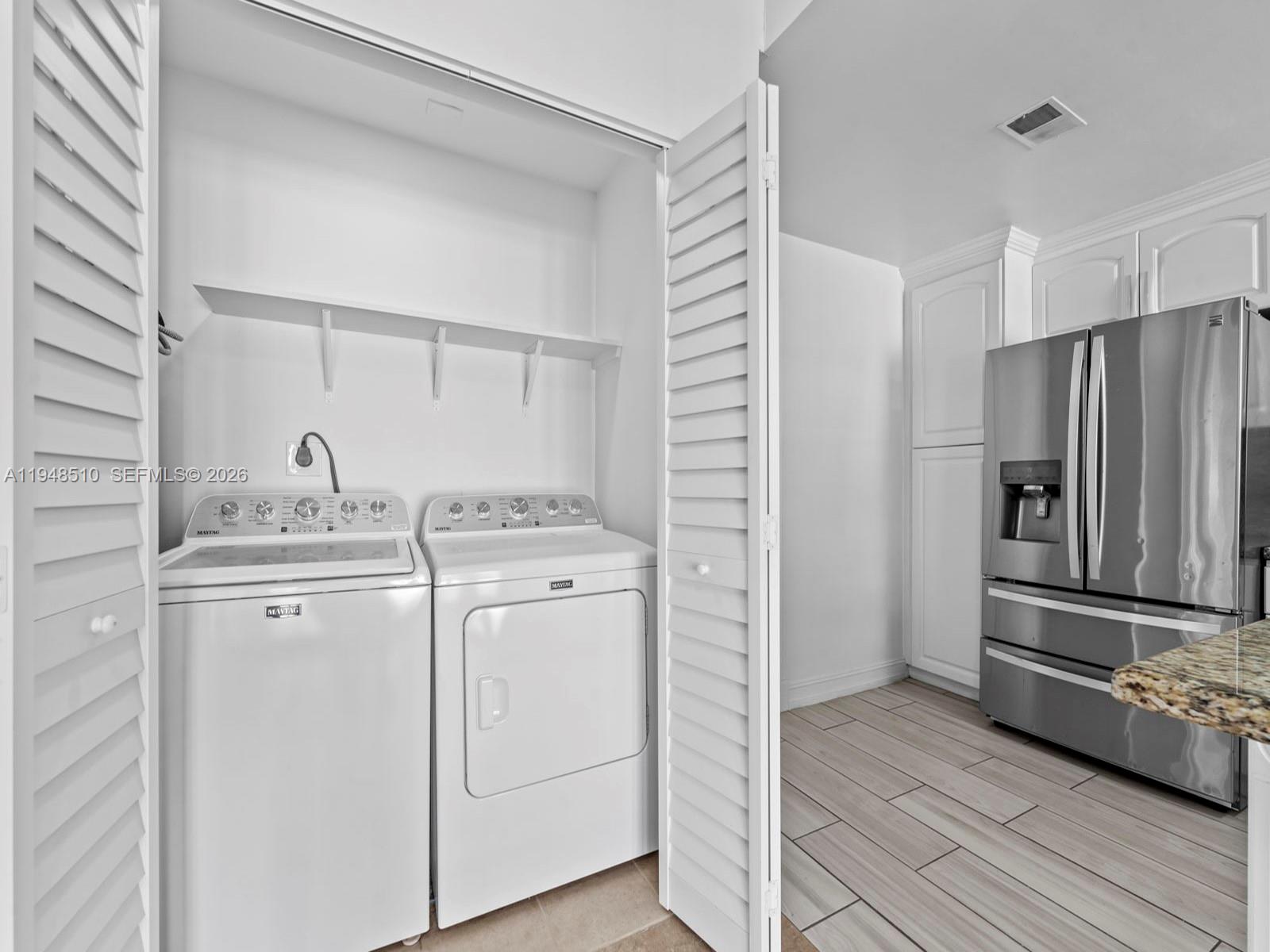 25921 Southwest 130th Avenue Homestead, FL 33032 - Photo 18 of 38 a kitchen with appliances a sink and cabinets
