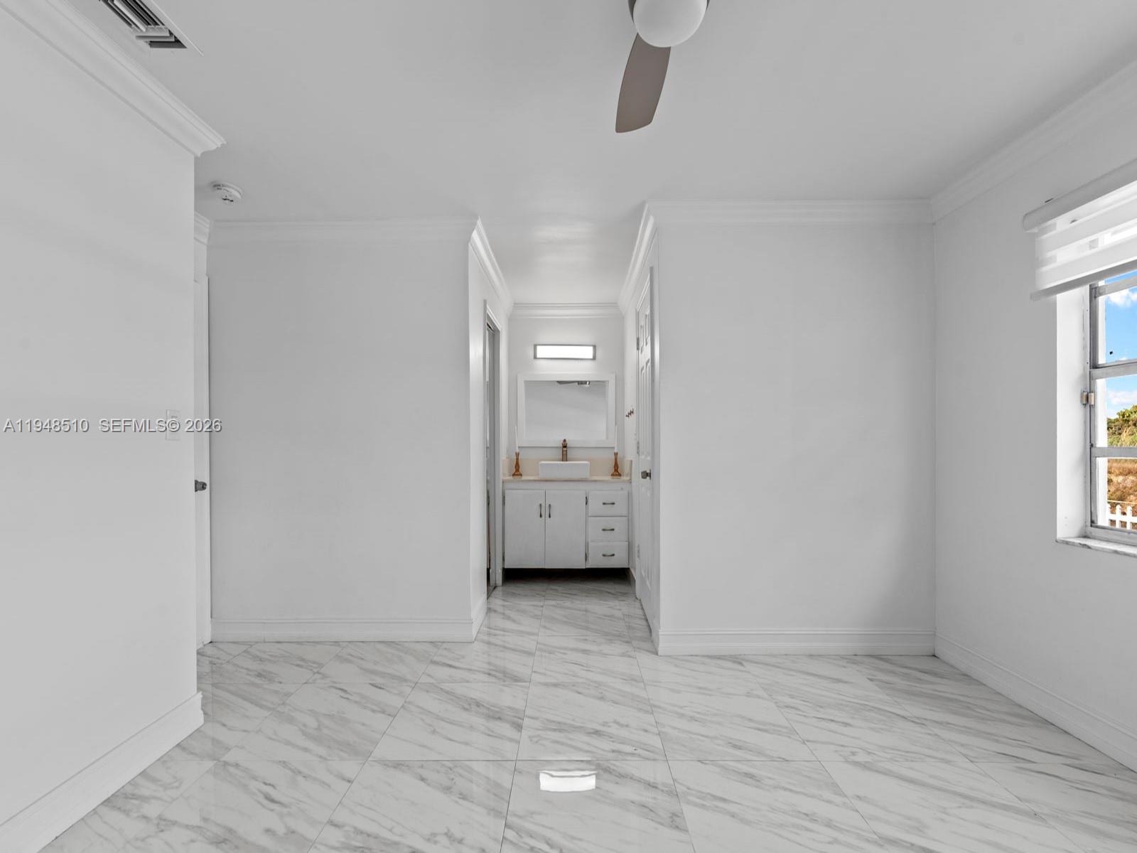 25921 Southwest 130th Avenue Homestead, FL 33032 - Photo 27 of 38 a view of an empty room with a window