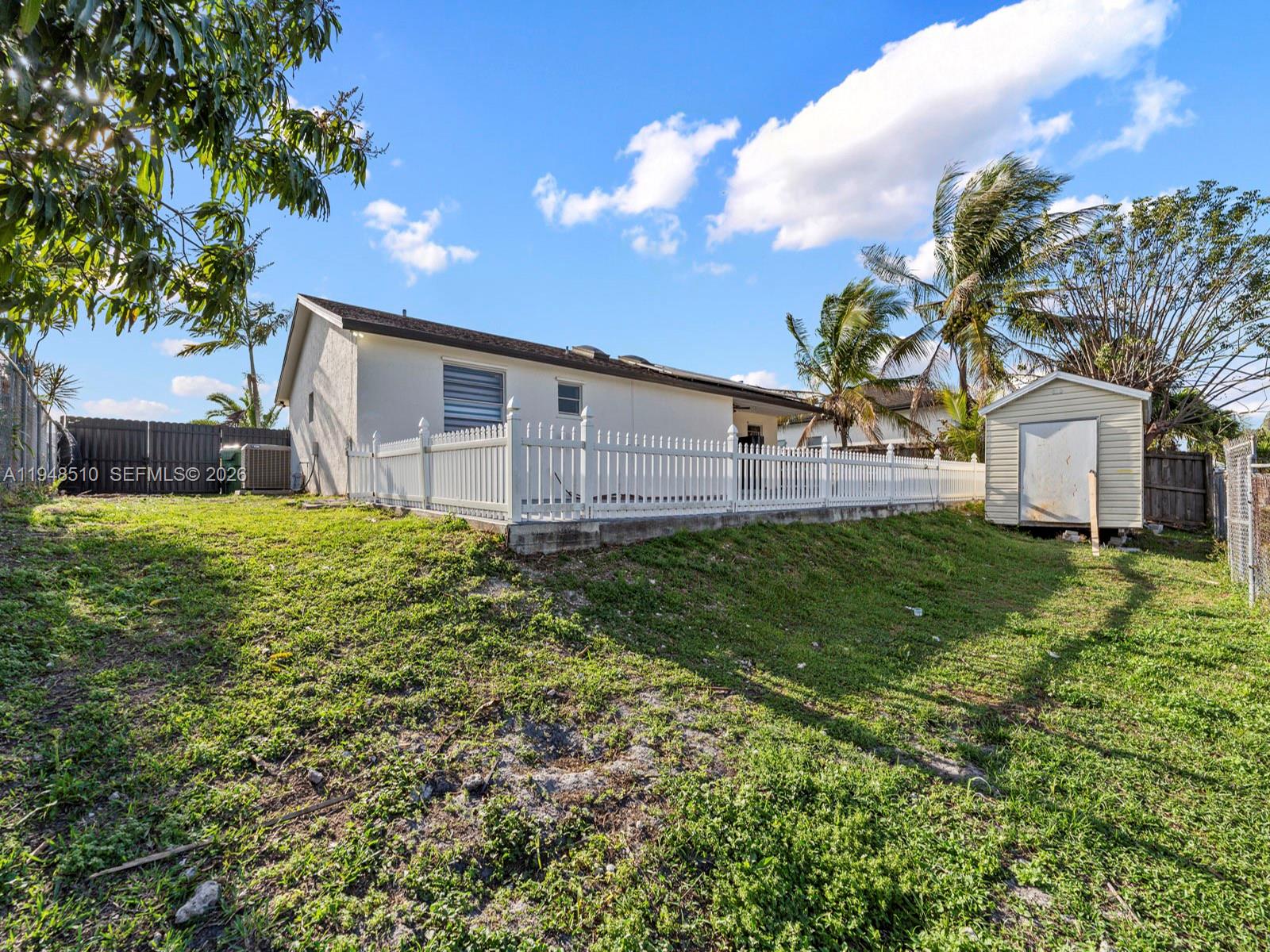 25921 Southwest 130th Avenue Homestead, FL 33032 - Photo 38 of 38 a view of a backyard with a garden