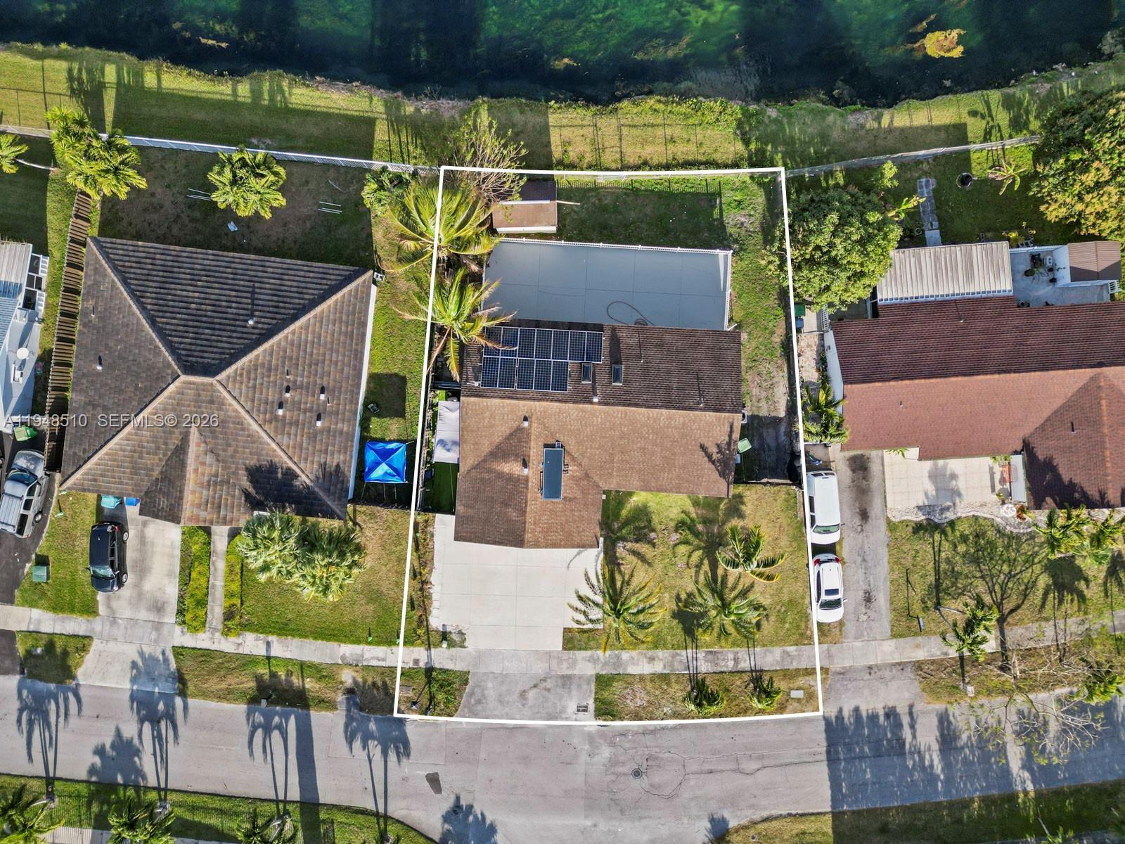 25921 Southwest 130th Avenue Homestead, FL 33032 - Photo 5 of 38 an aerial view of houses with outdoor space