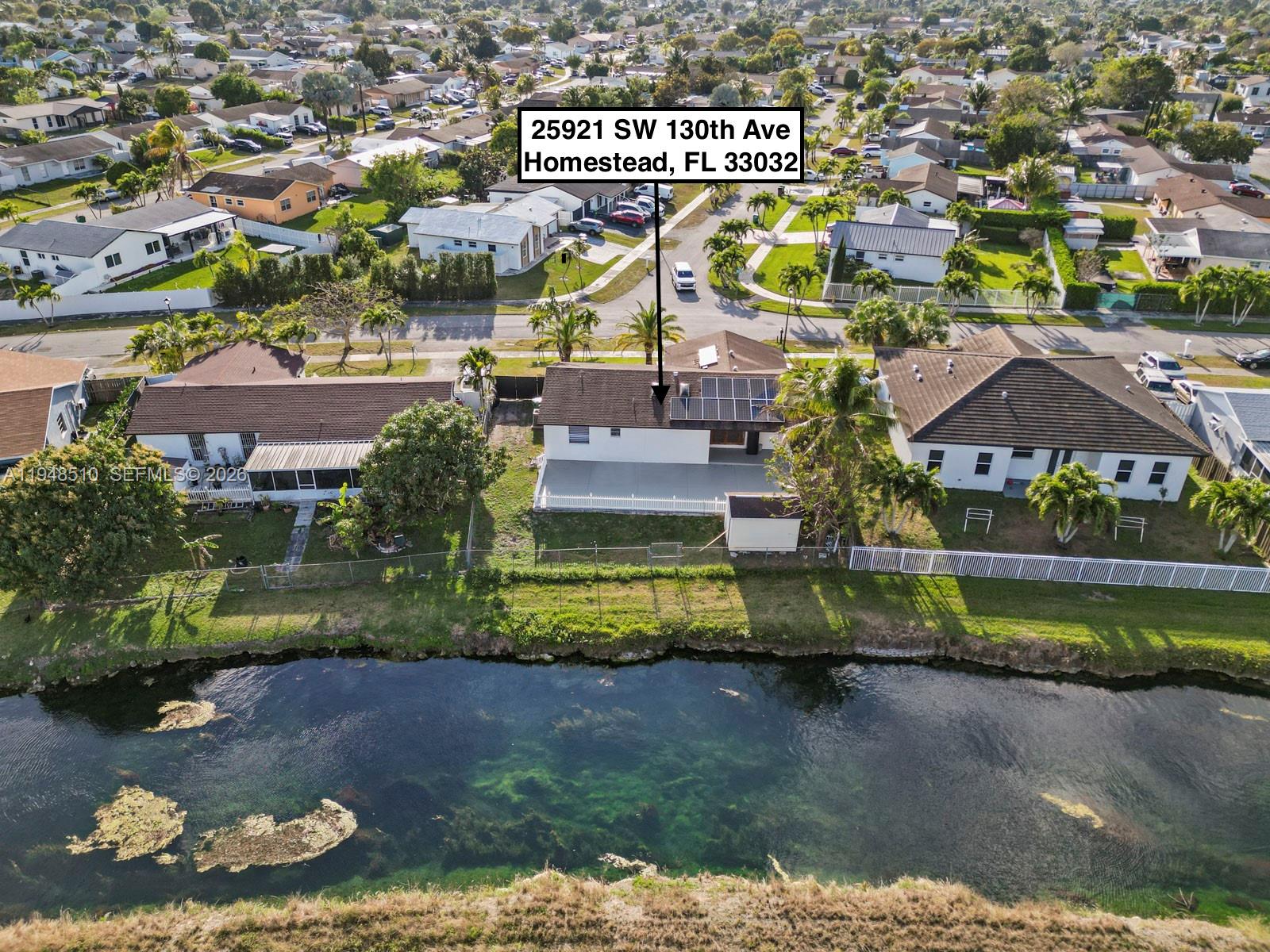 25921 Southwest 130th Avenue Homestead, FL 33032 - Photo 6 of 38 a view of a water with a building in the background