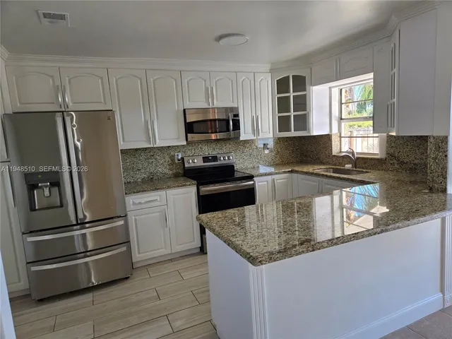 a utility room with washer and dryer