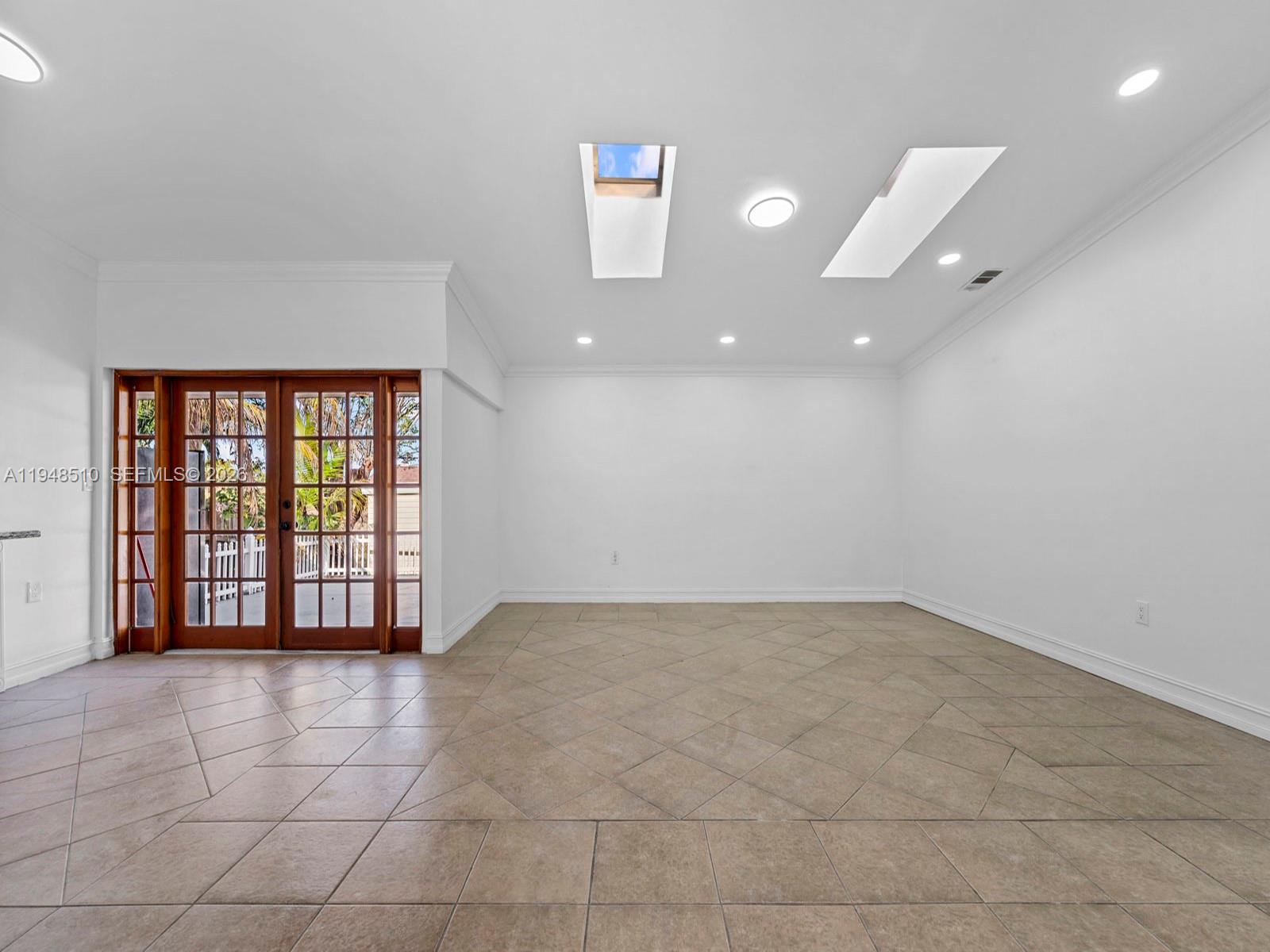 25921 Southwest 130th Avenue Homestead, FL 33032 - Photo 9 of 38 a view of an empty room with a window