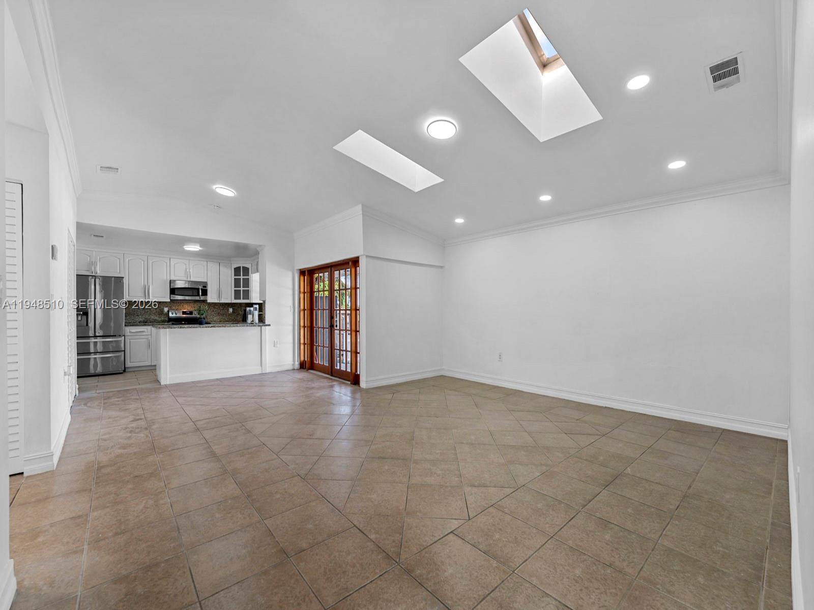 25921 Southwest 130th Avenue Homestead, FL 33032 - Photo 10 of 38 a view of kitchen with refrigerator and window