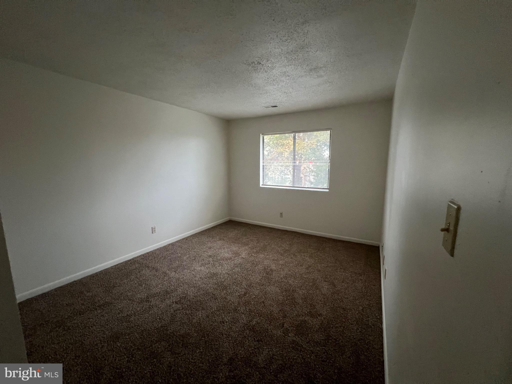 610-402 Noahs Road, Unit 402 Pleasantville, NJ 08232 - Photo 4 of 7 a view of an empty room with windows