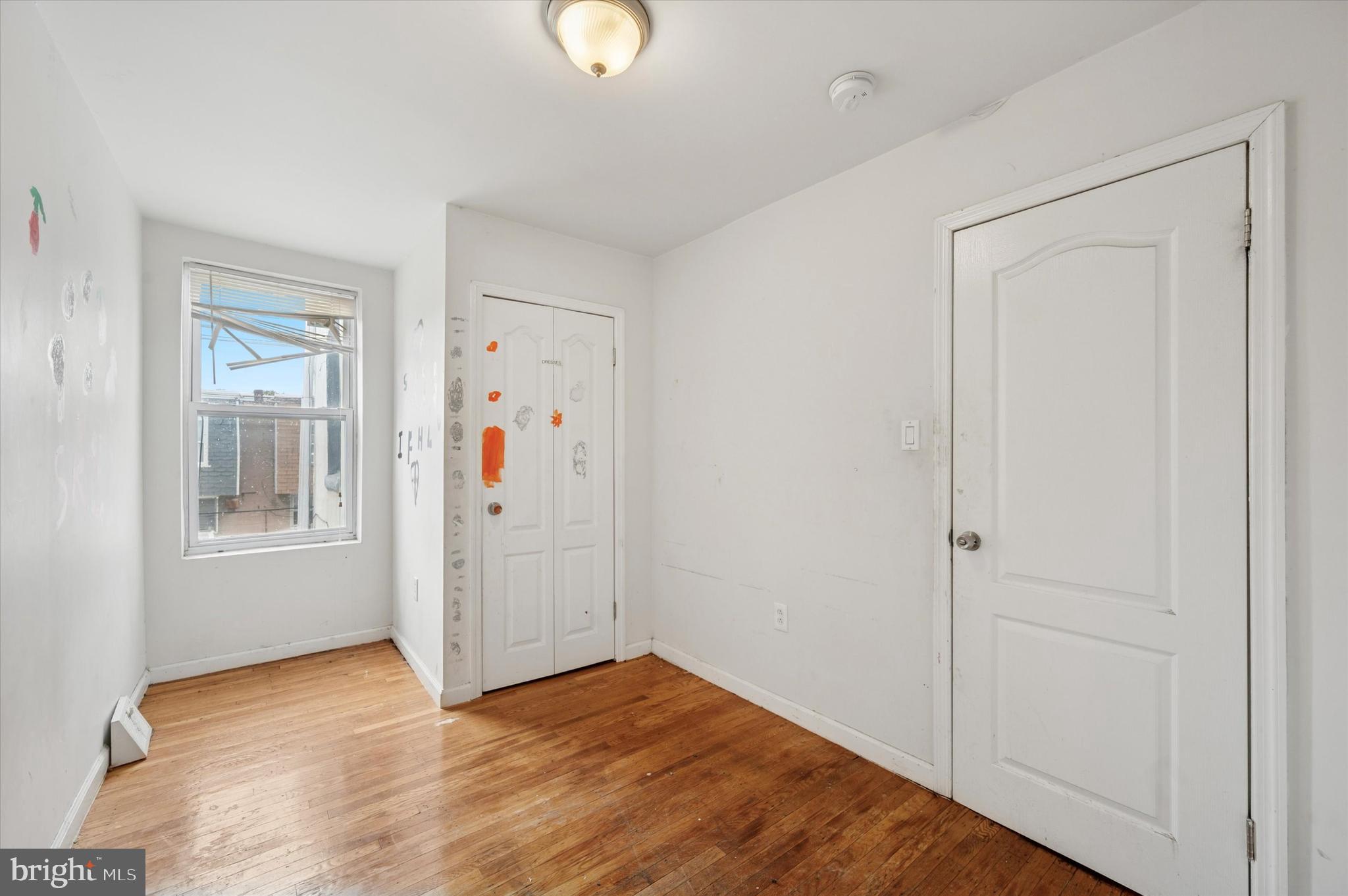249 West Calvert Street Philadelphia, PA 19120 - Photo 15 of 25 a view of a livingroom with wooden floor and windows
