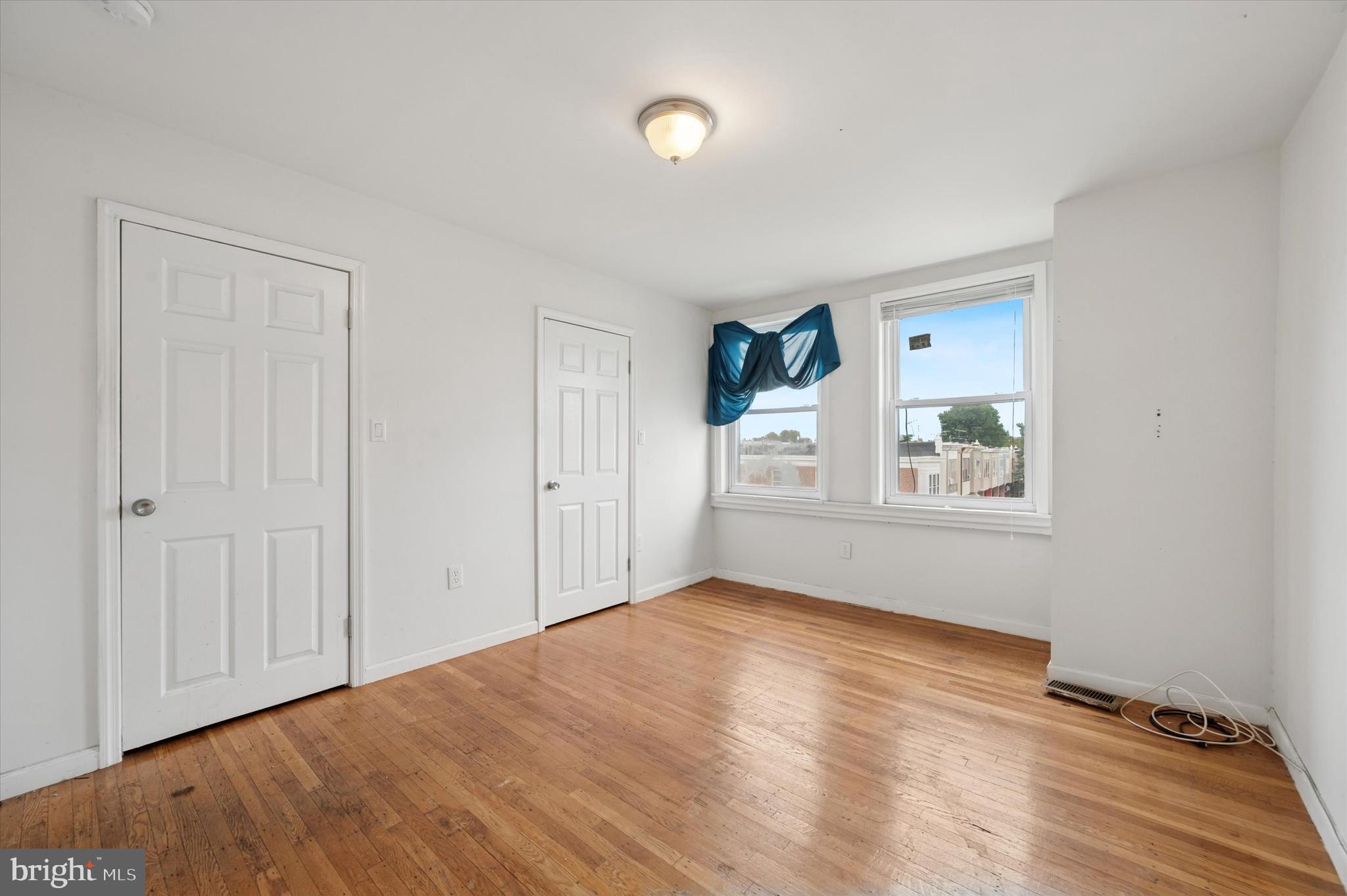 249 West Calvert Street Philadelphia, PA 19120 - Photo 18 of 25 a view of empty room with window and wooden floor