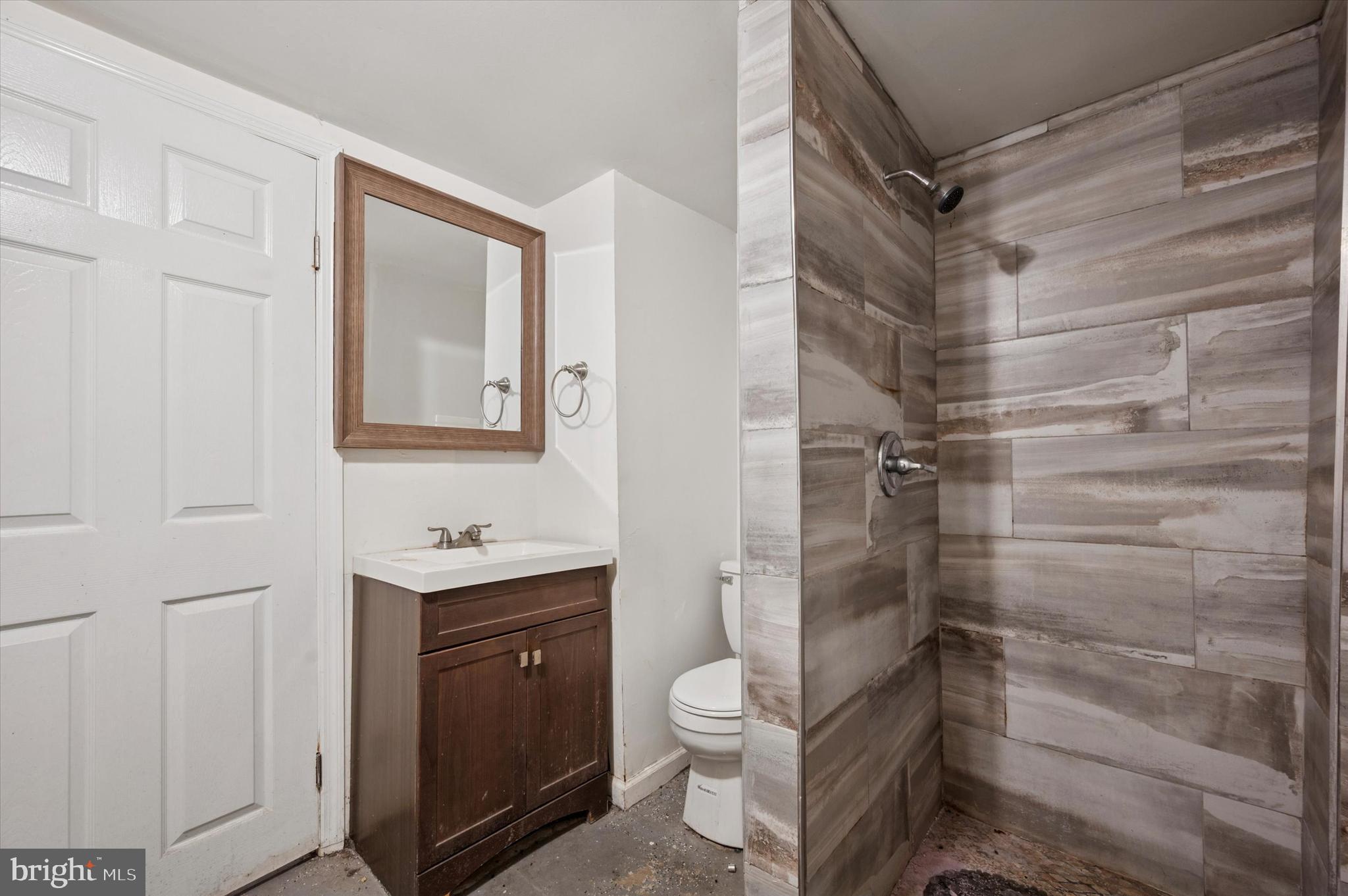 249 West Calvert Street Philadelphia, PA 19120 - Photo 20 of 25 a bathroom with a shower toilet and sink