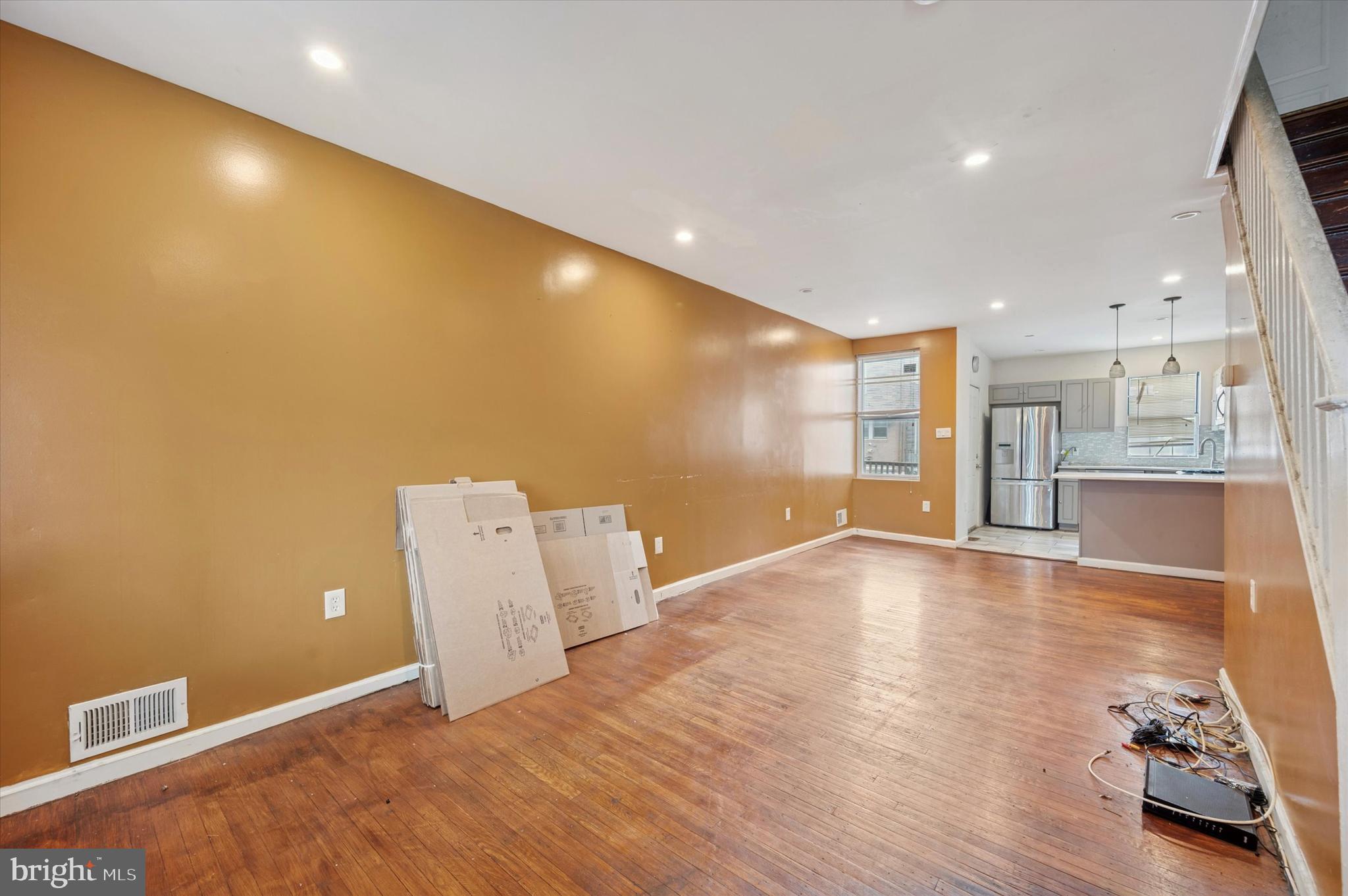 249 West Calvert Street Philadelphia, PA 19120 - Photo 3 of 25 a view of an empty room with wooden floor