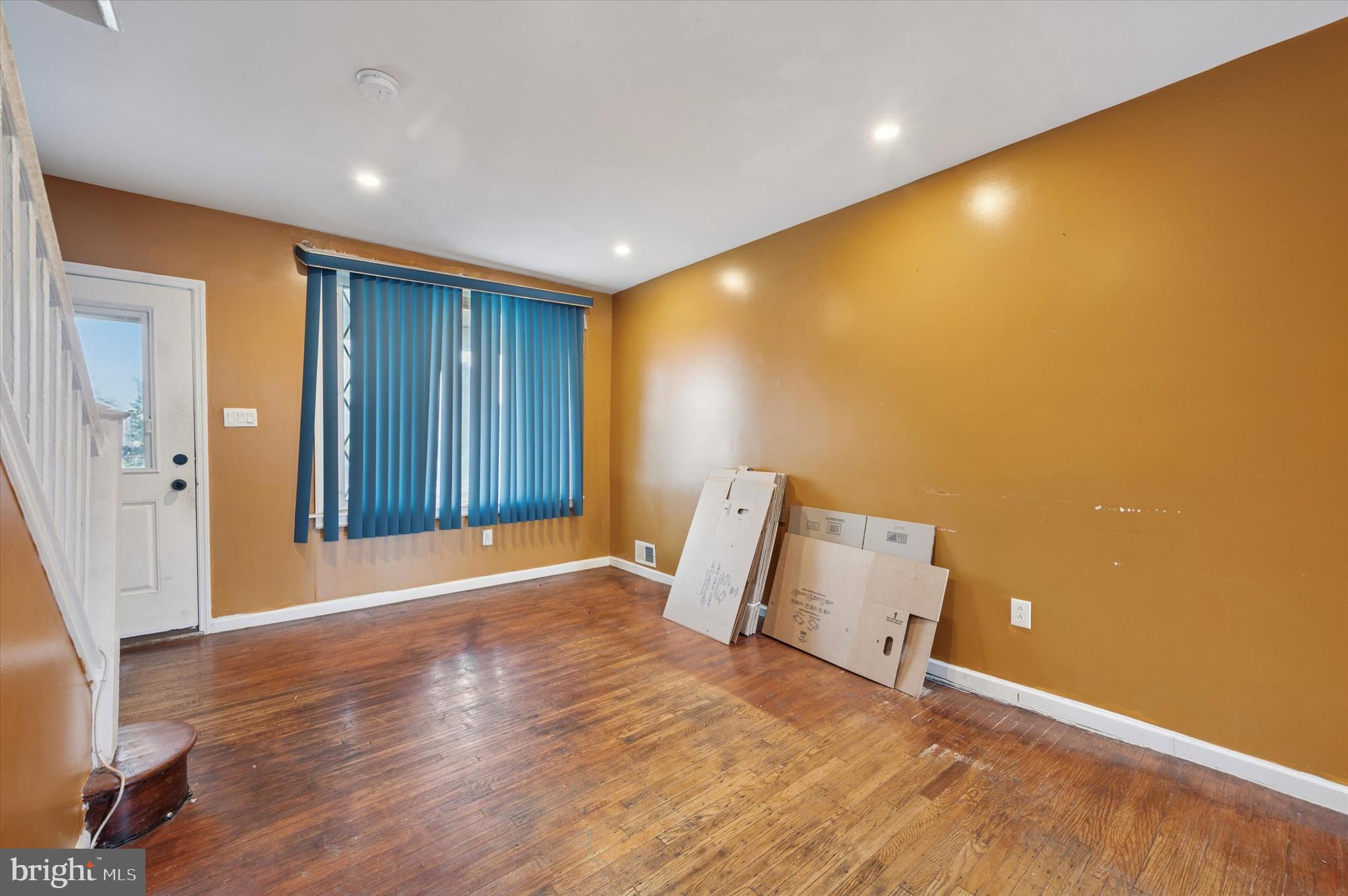 249 West Calvert Street Philadelphia, PA 19120 - Photo 6 of 25 an empty room with wooden floor and a window