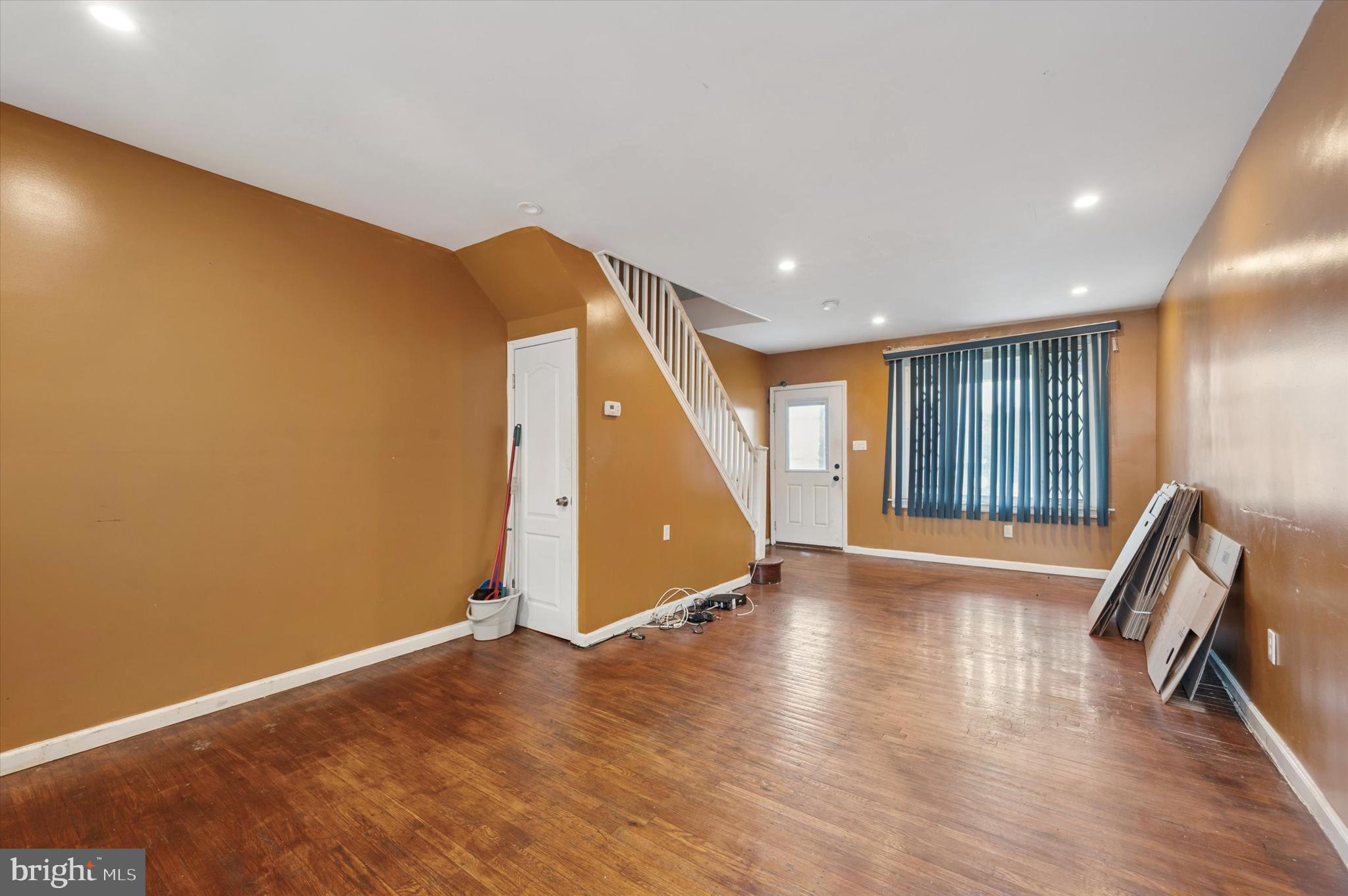 249 West Calvert Street Philadelphia, PA 19120 - Photo 7 of 25 a view of an empty room with wooden floor and a window