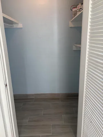 a view of an empty walk in closet