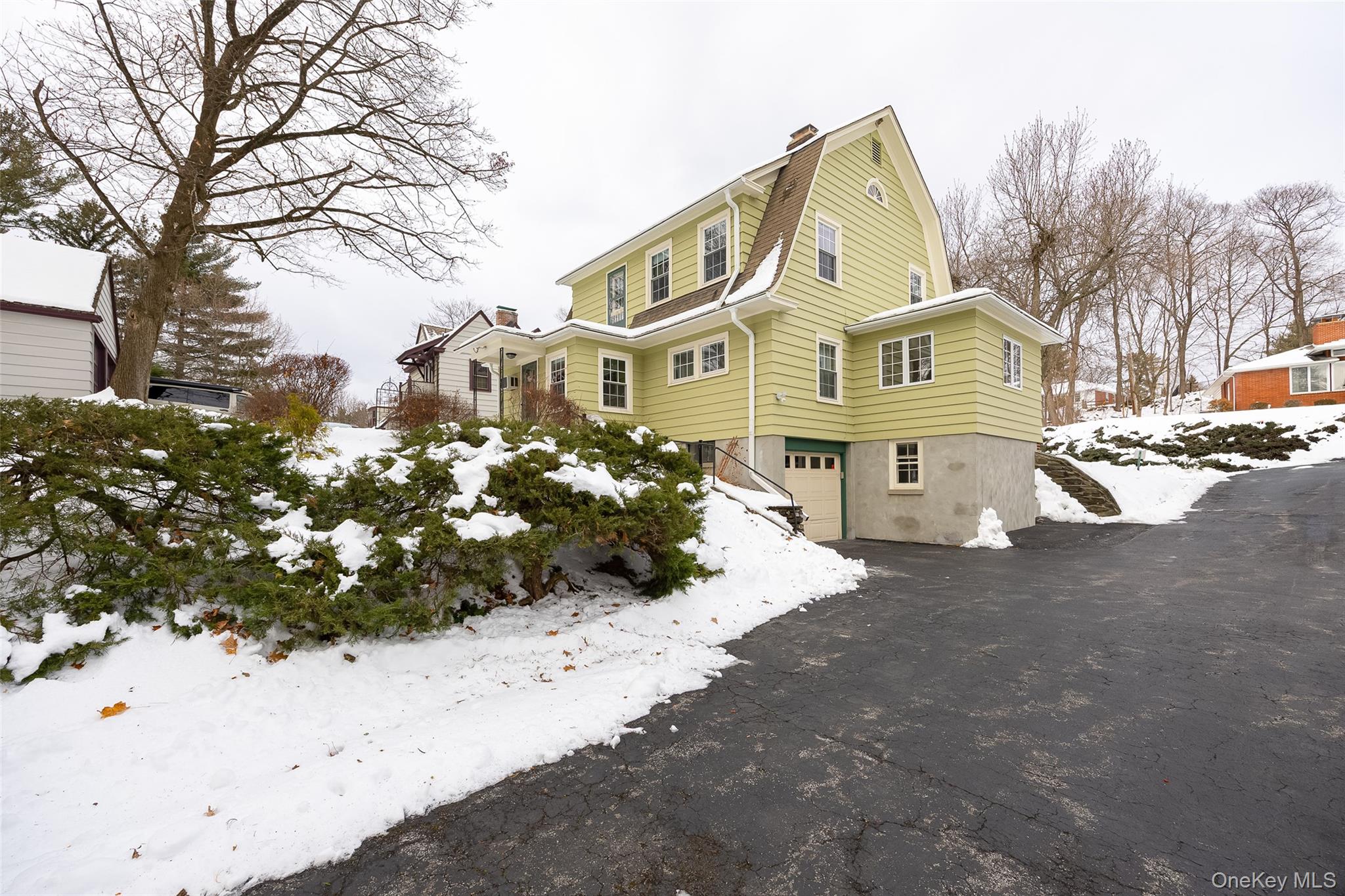 6 Rosalind Road Poughkeepsie, NY 12601 - Photo 27 of 30 a front view of a house with a yard covered in snow