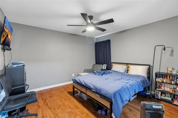 a bedroom with a bed and a bookshelf