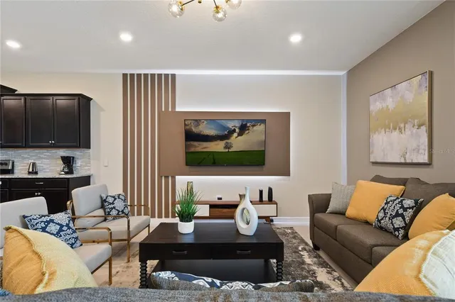 a view of a dining room with furniture and a mirror