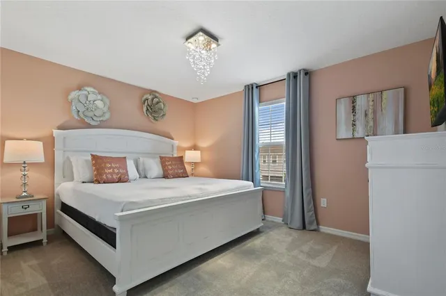 a bedroom with a bed and dresser