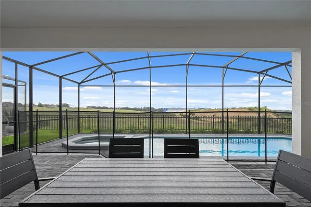 a view of a living room and floor to ceiling window