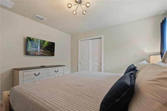a living room with lots of furniture and a flat screen tv