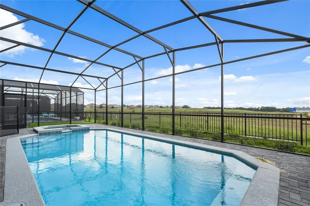 a view of a swimming pool with a patio