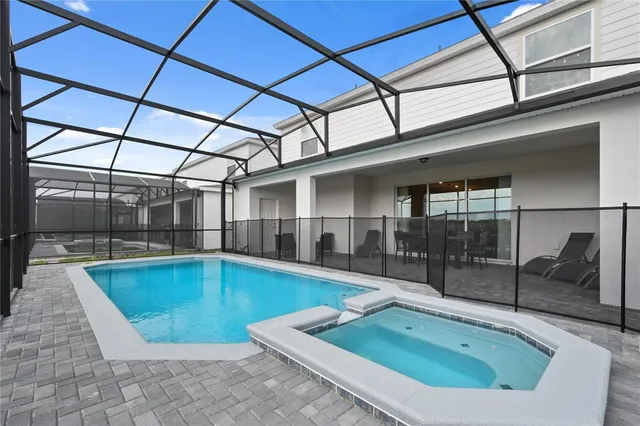 a view of a hallway with paintings on the wall