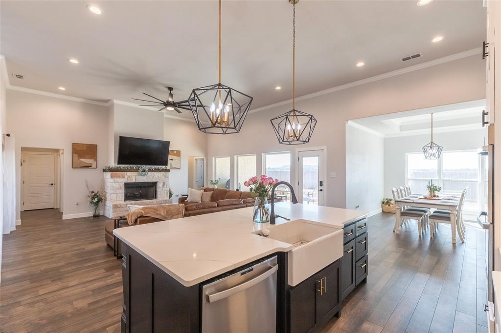a large kitchen with a table and chairs