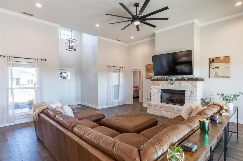 107 Kleingrass Road Abilene, TX 79606 - Photo 9 of 39 a living room with furniture and a flat screen tv