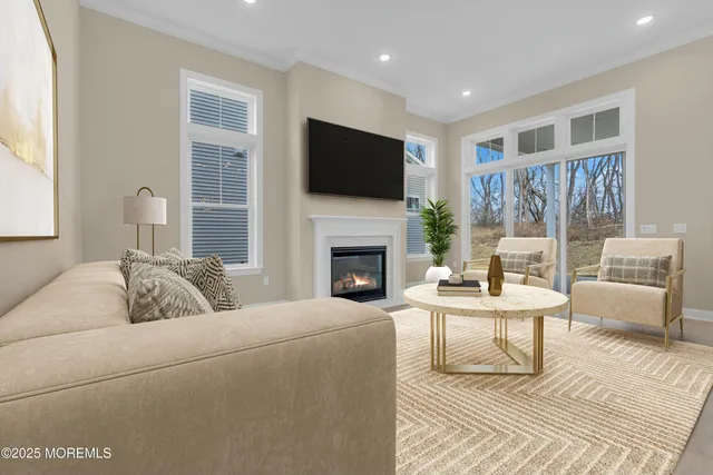 a living room with furniture fireplace and flat screen tv