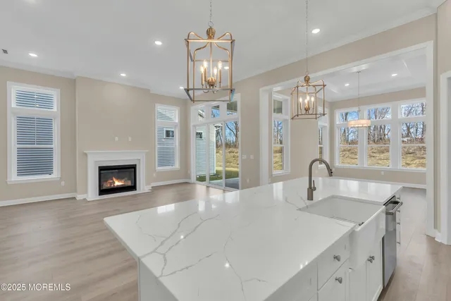 a view of kitchen with center island and stainless steel appliances