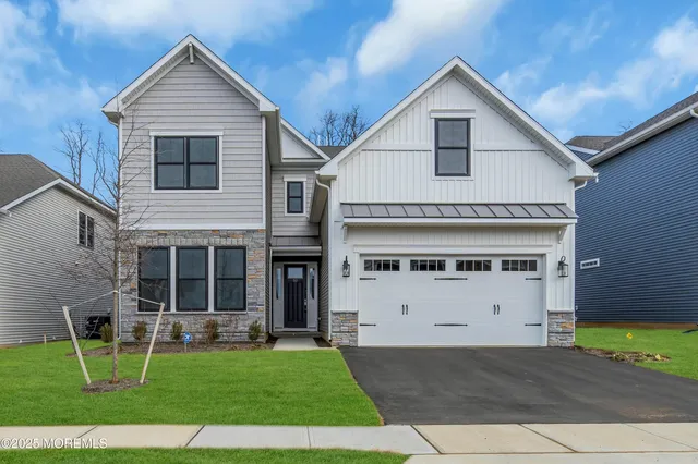 a view of house with yard and entertaining space