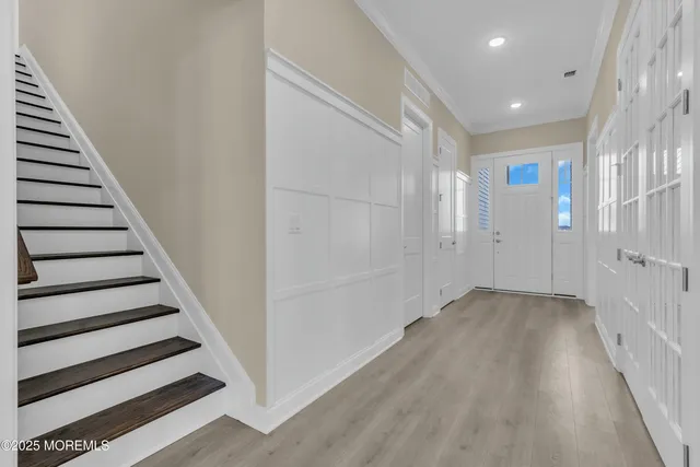 a view of entryway with wooden floor