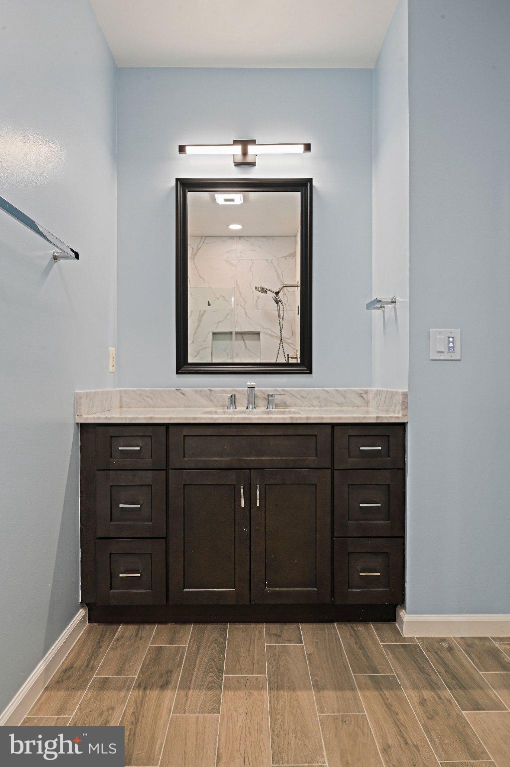 1519 North Point Drive, Unit 202 Reston, VA 20194 - Photo 23 of 49 Sleek bathroom with modern elegance.