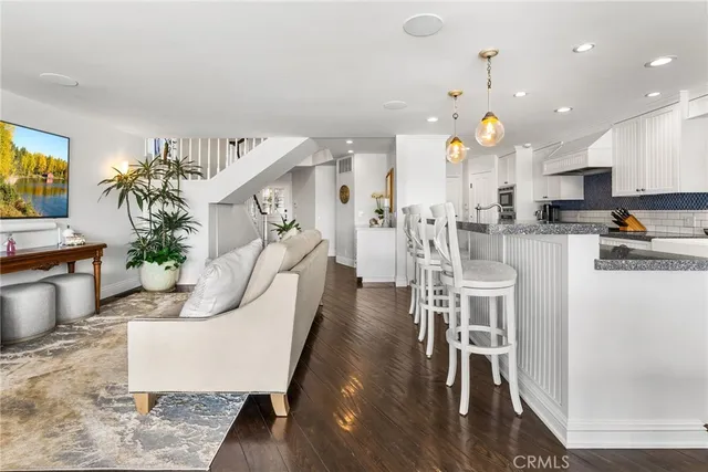 a kitchen with stainless steel appliances granite countertop a stove and a sink