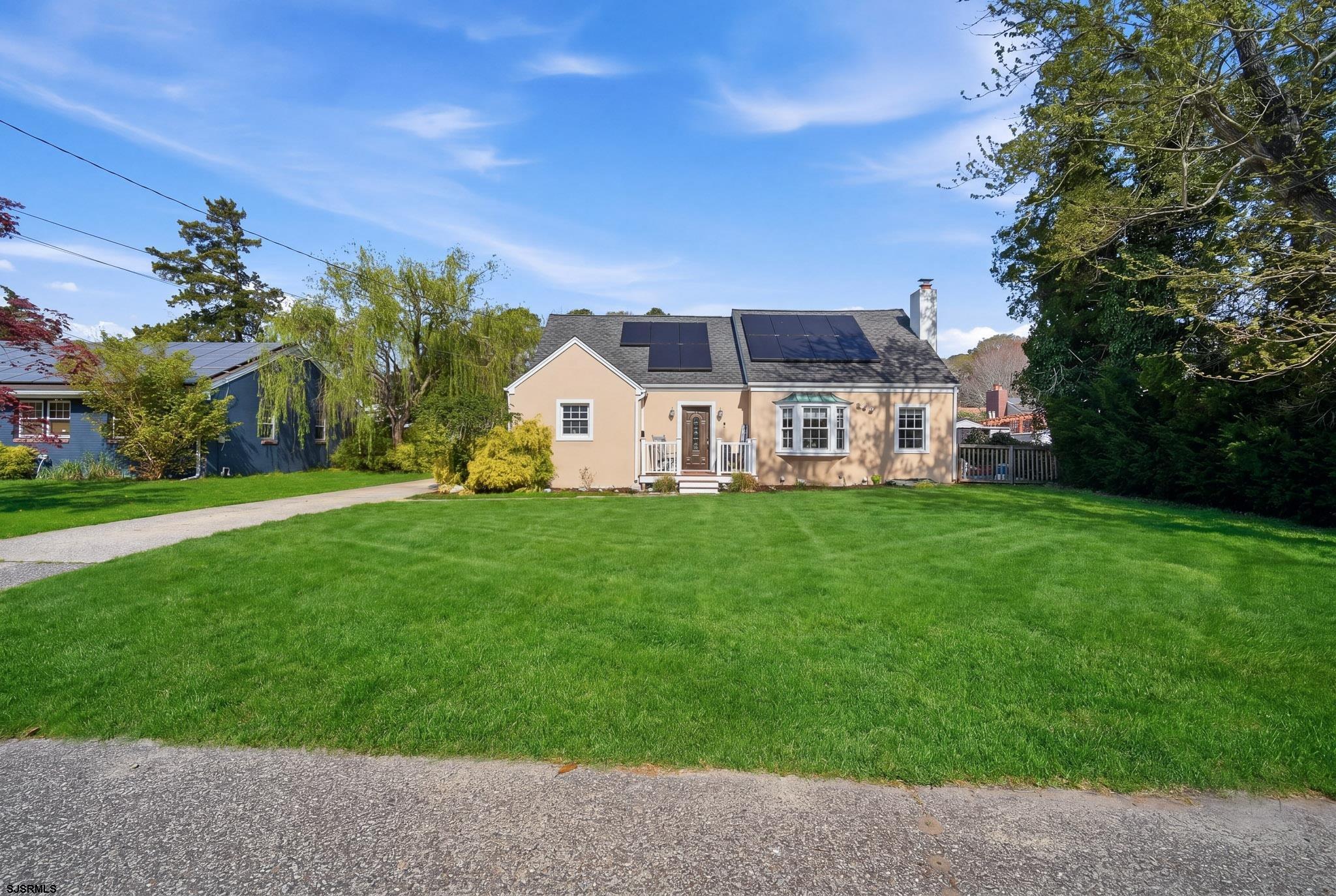 395 1st Street Northfield, NJ 08225 - Photo 1 of 54 a front view of a house with garden